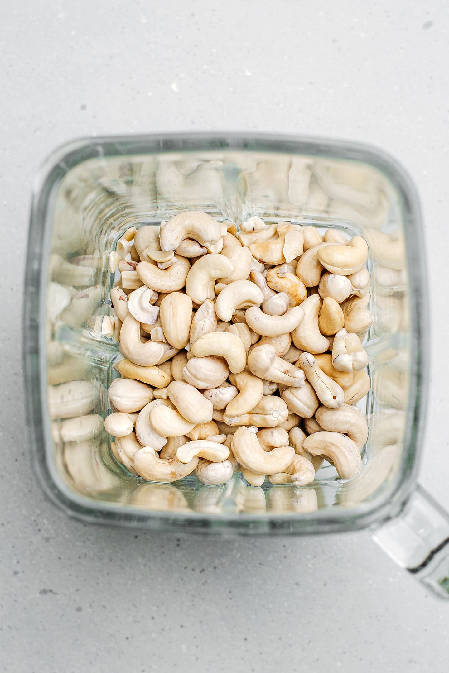 Raw cashews and water in a blender.