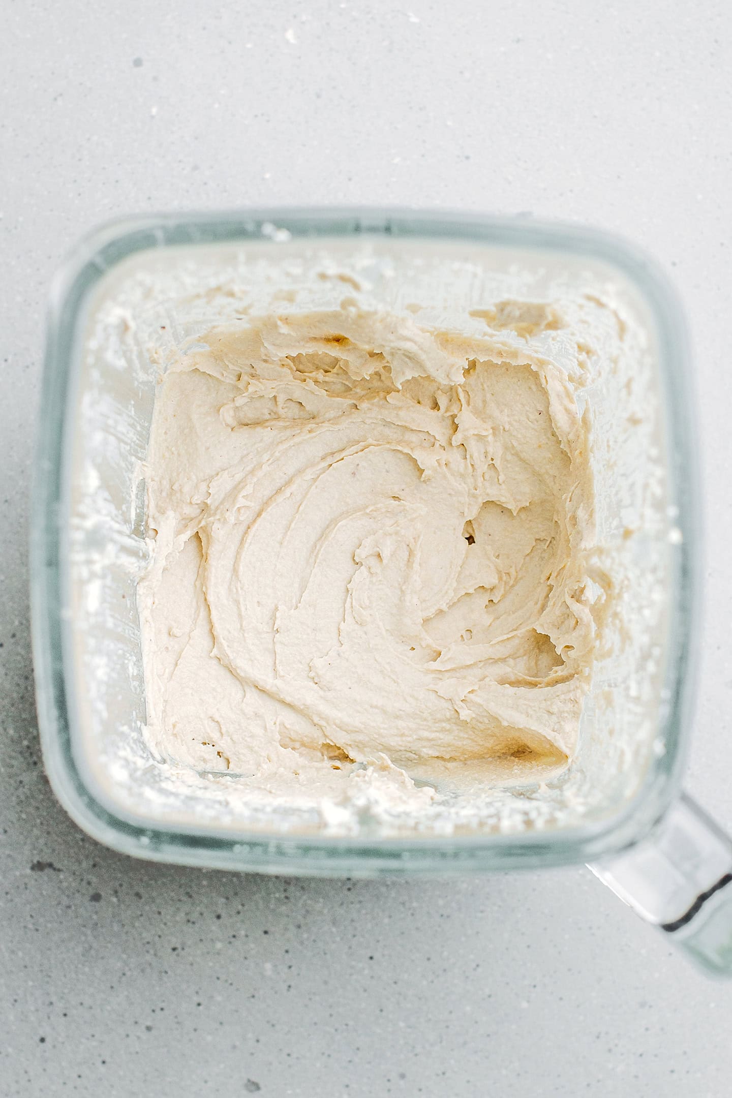 Blended cashew cream in a blender.