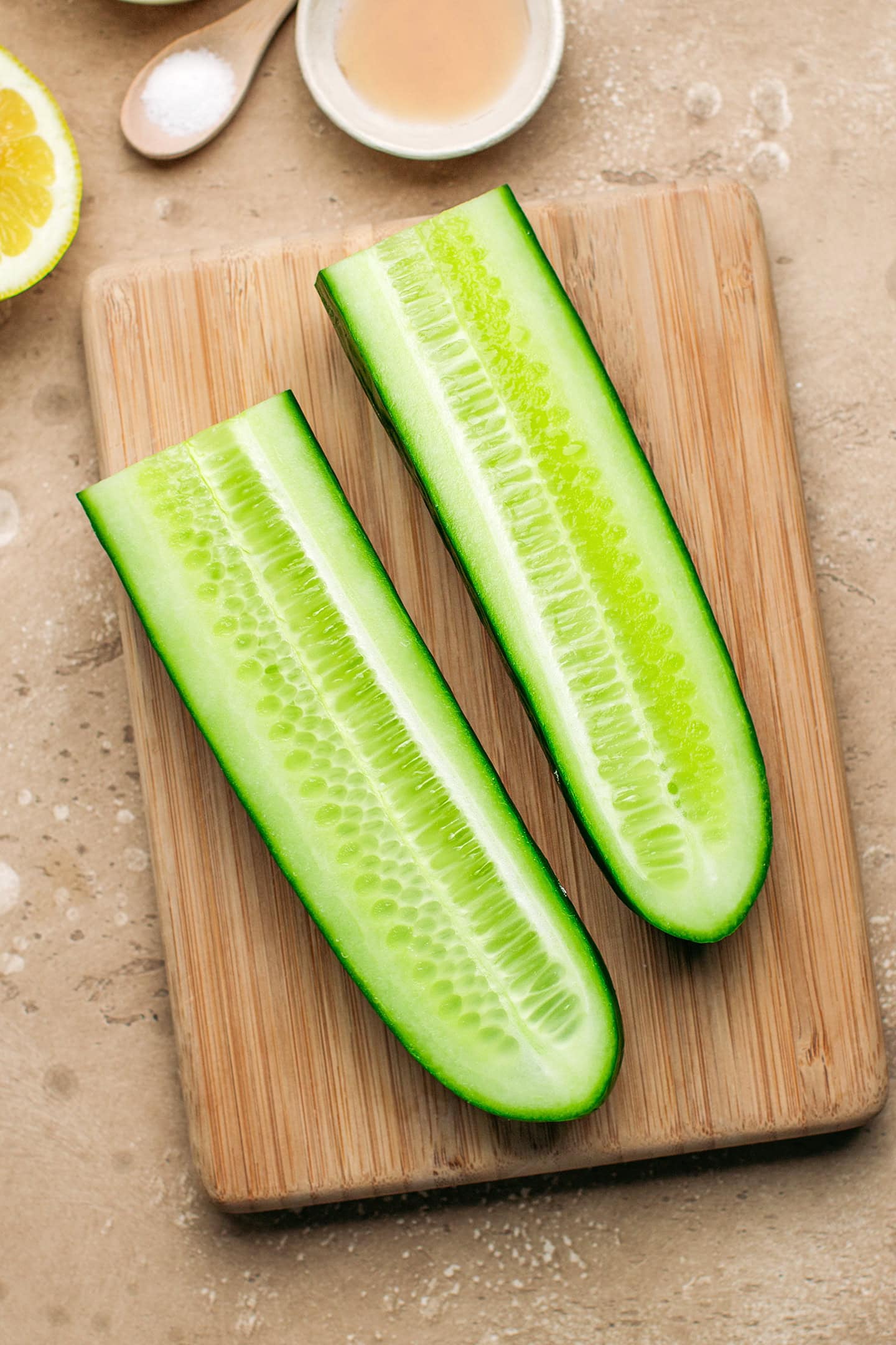 Sliced cucumber on a chopping board.