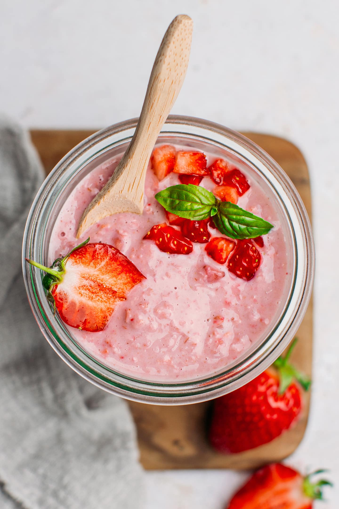 Top view of a jar containing strawberry overnight oats.