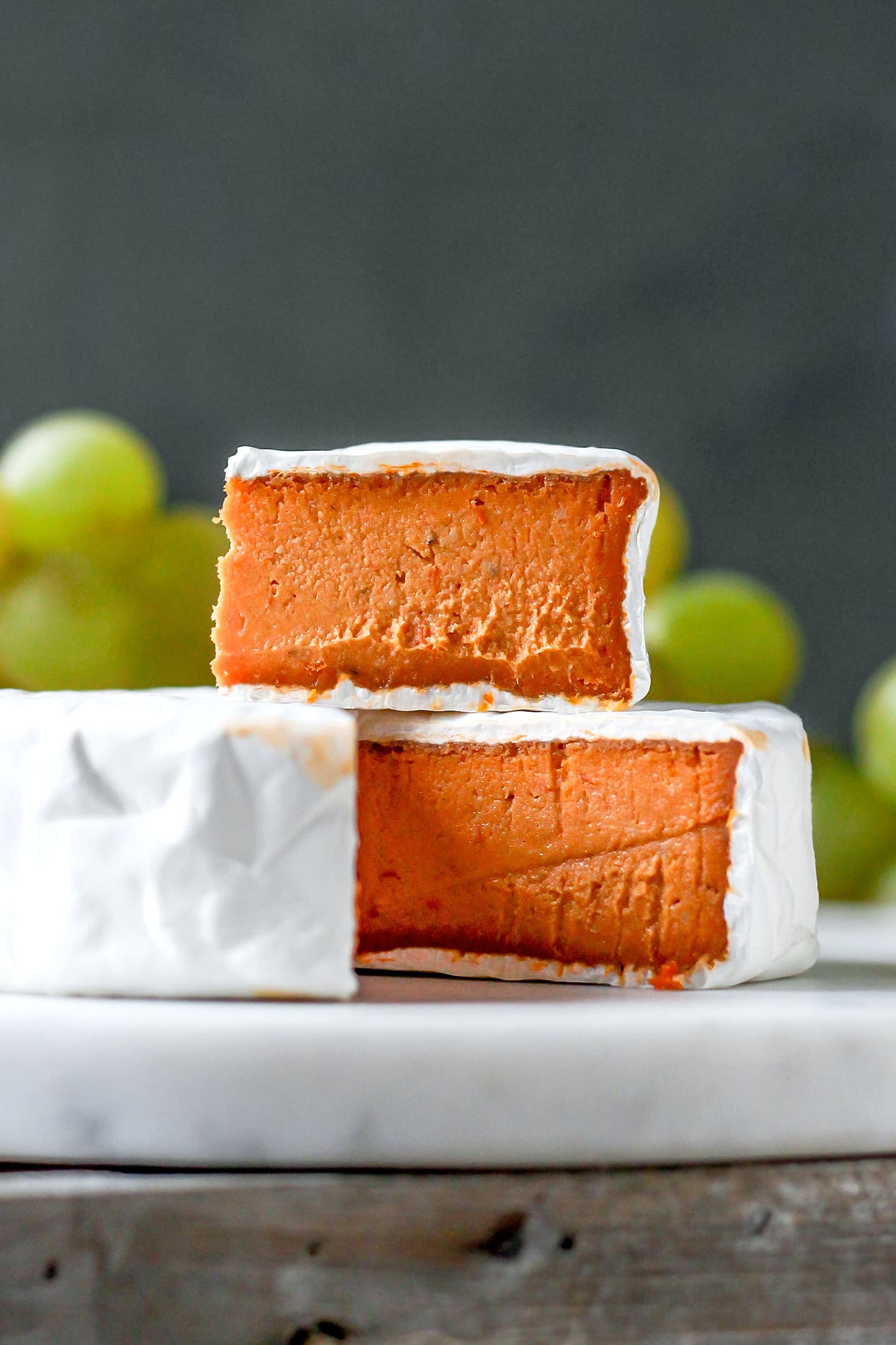 Sliced vegan tomato camembert.