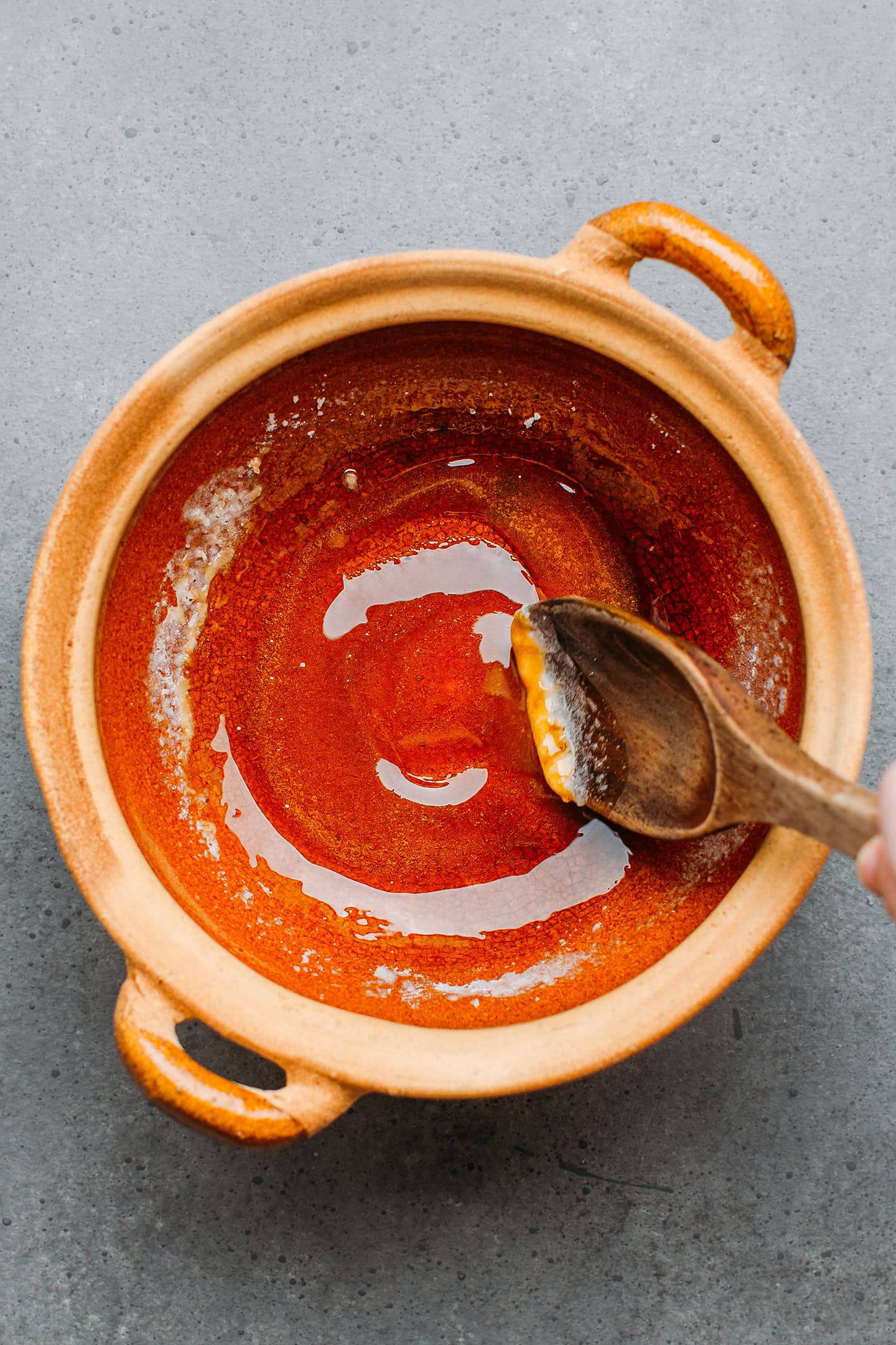 Making caramel in a clay pot.