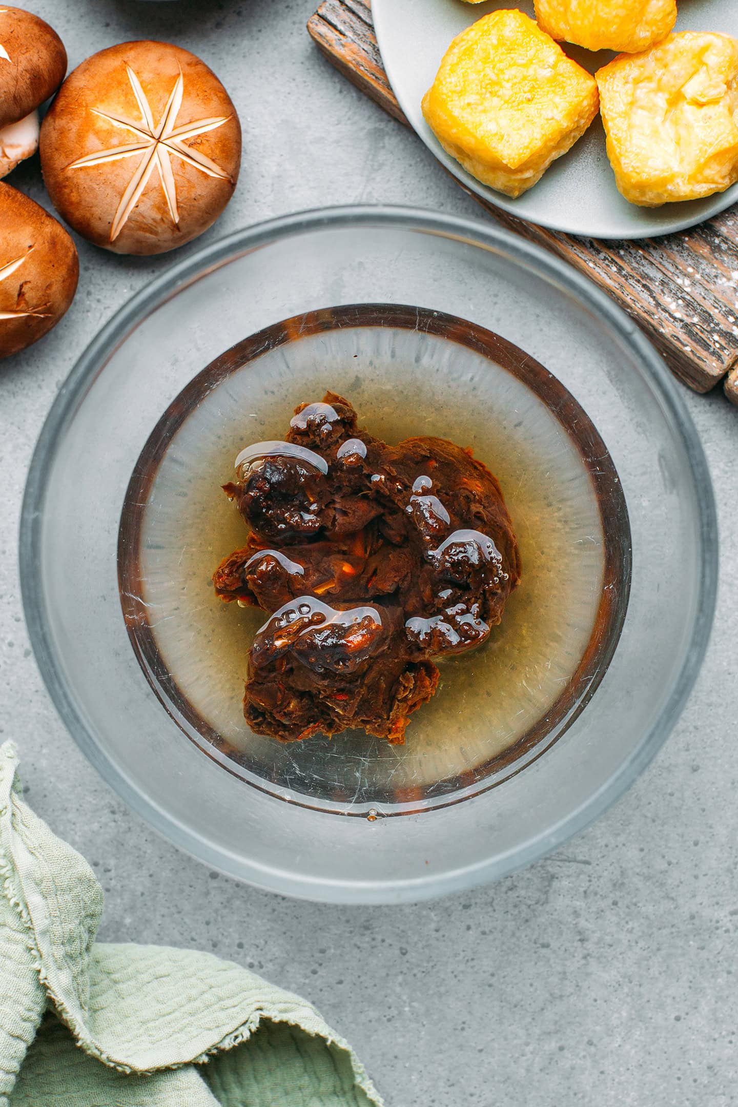 Tamarind pulp soaking in a bowl of water.