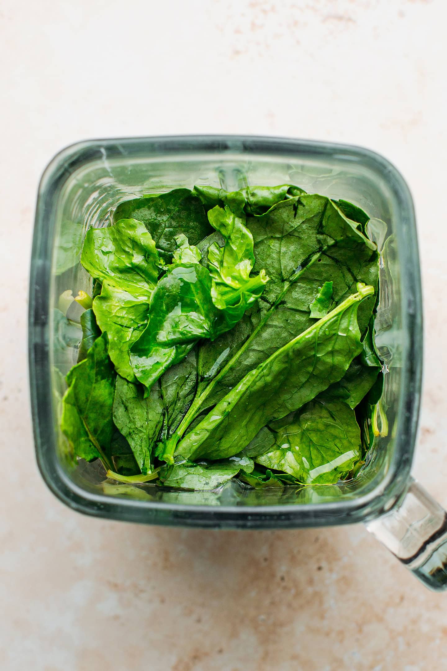 Spinach and water in a blender.