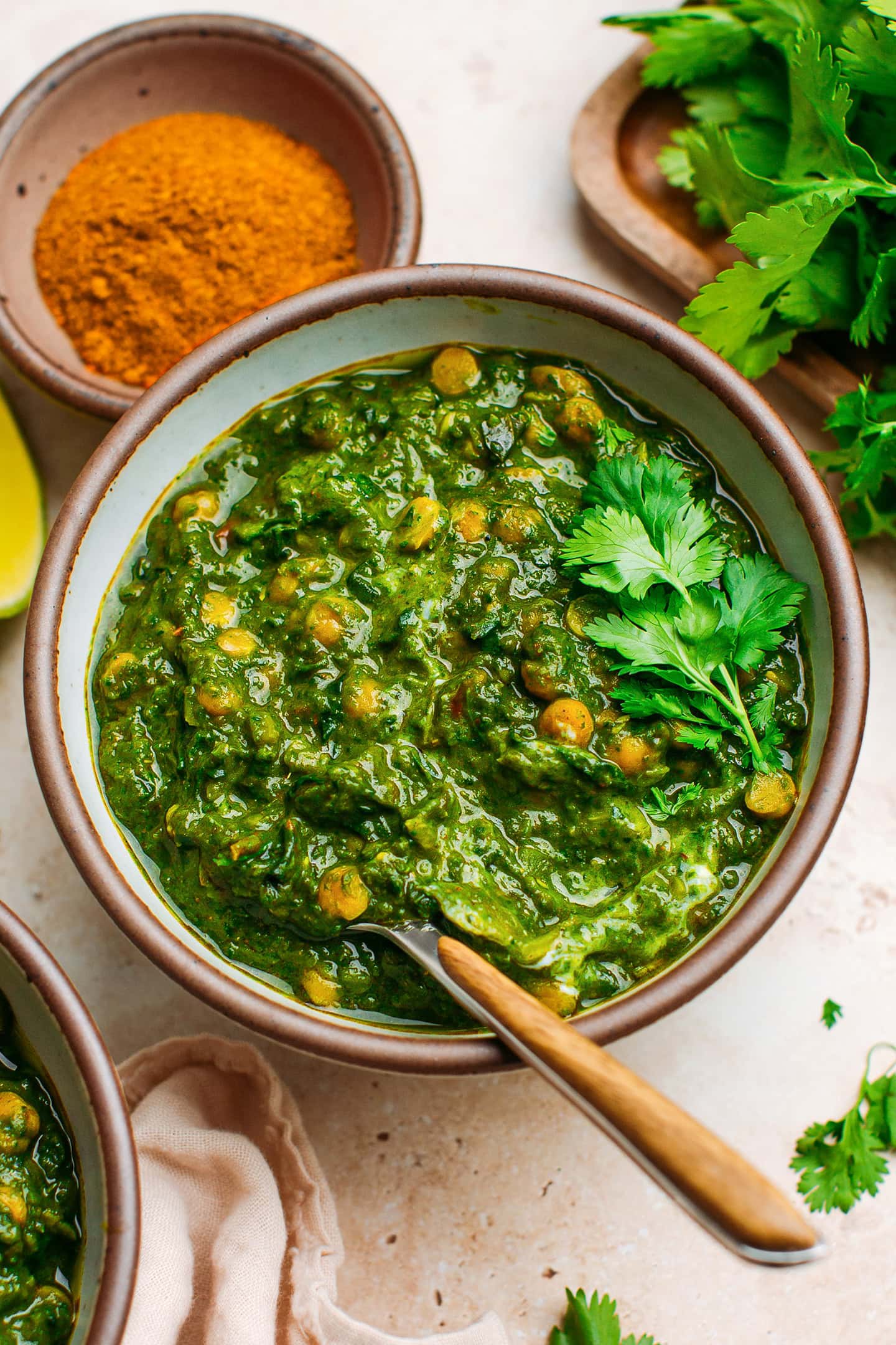 Spinach dal with chicpkeas and red lentils in a bowl.