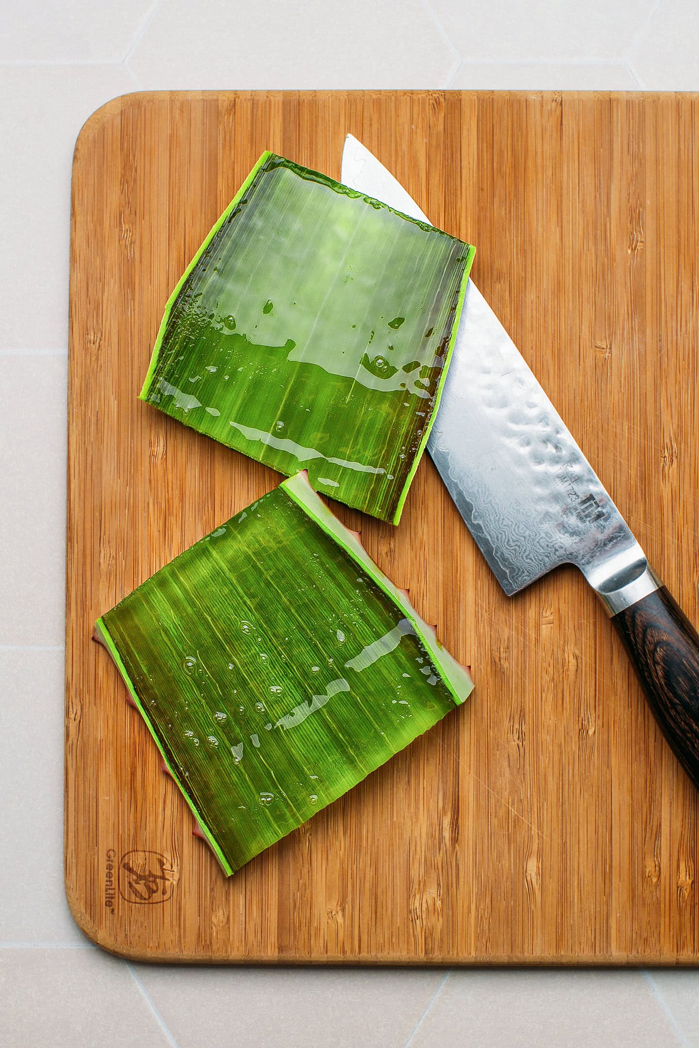 Sliced aloe vera leaf on a cutting board.