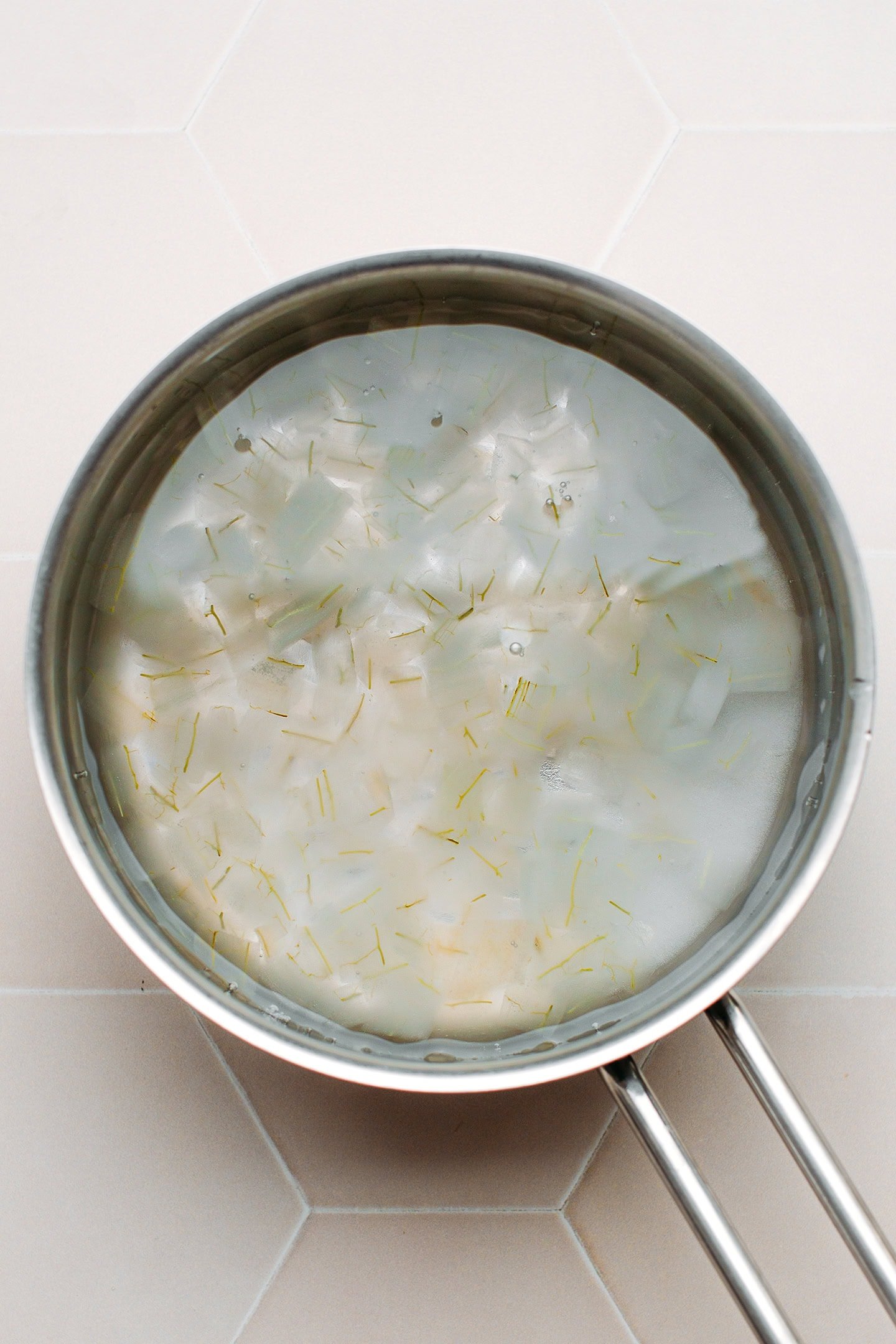 Diced aloe vera boiled in a pan.