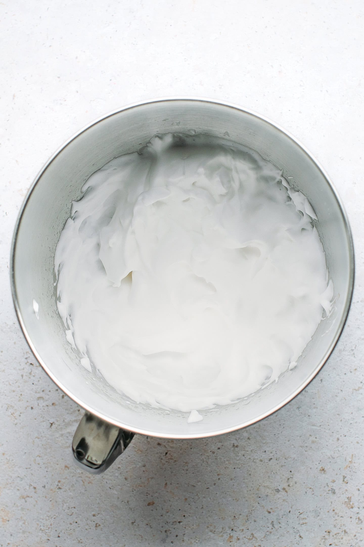 Whipped aquafaba in a bowl.