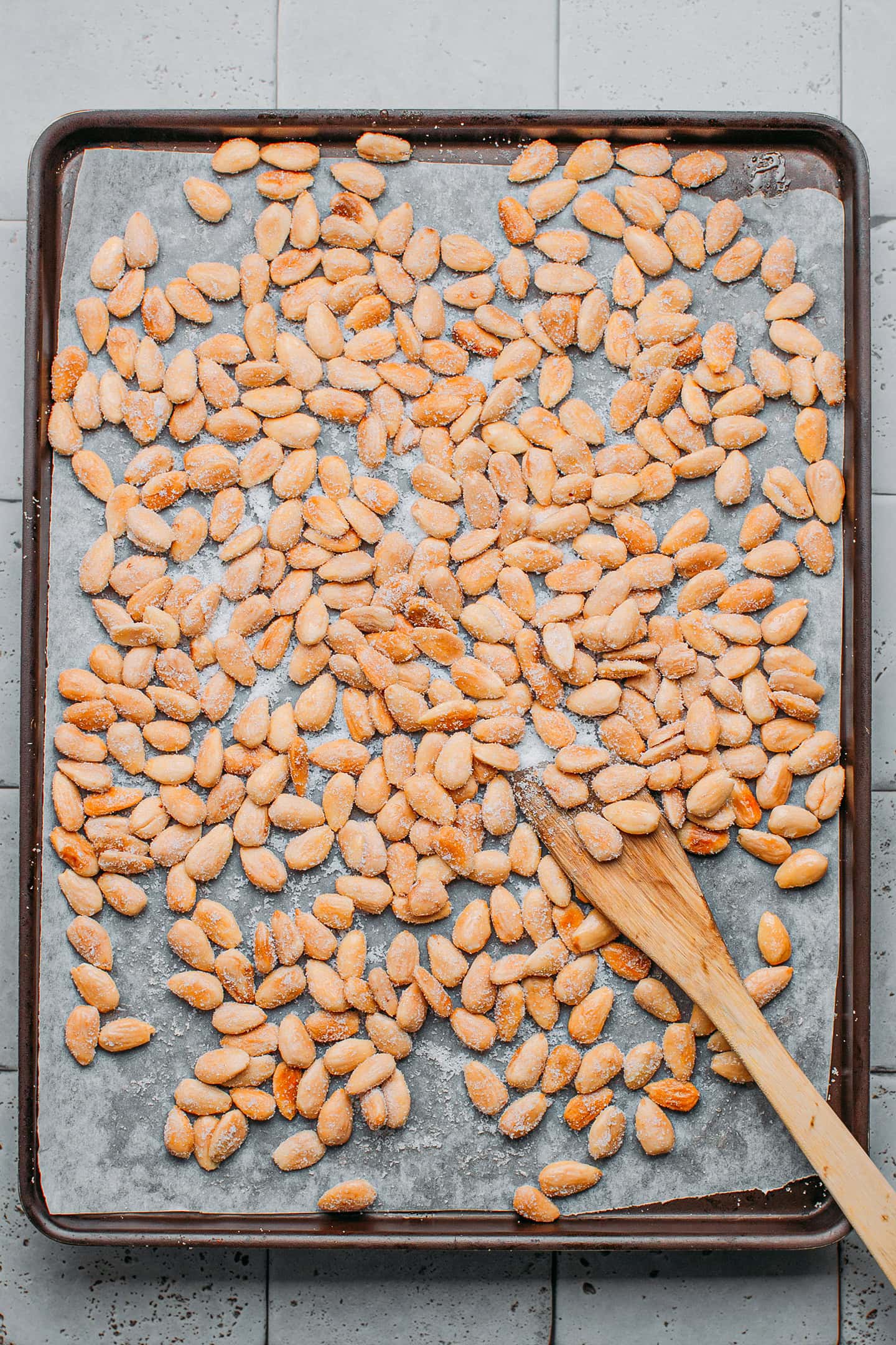 Sweet and salty almonds on a baking sheet.