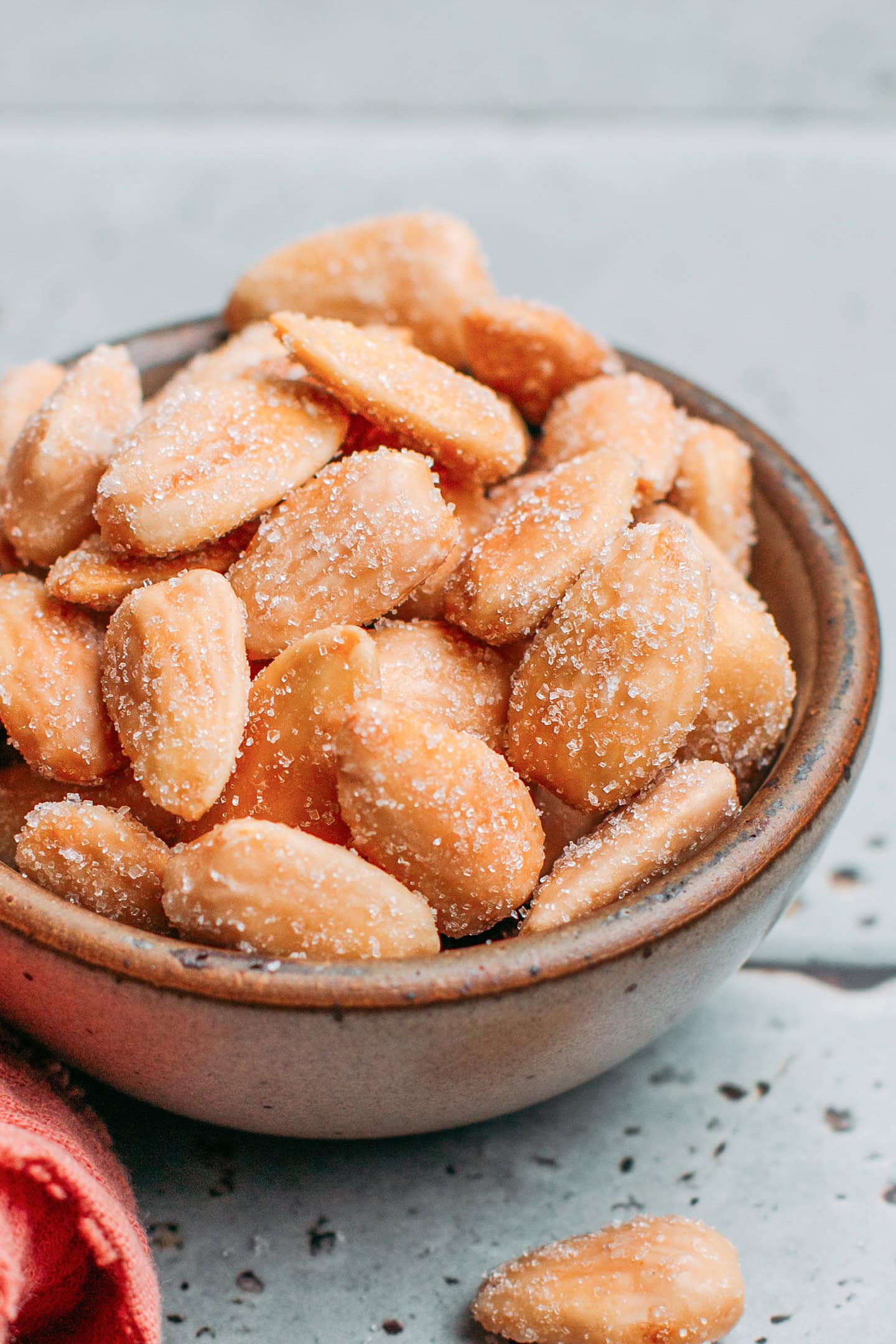 Close-up of roasted almonds tossed with sugar and salt.