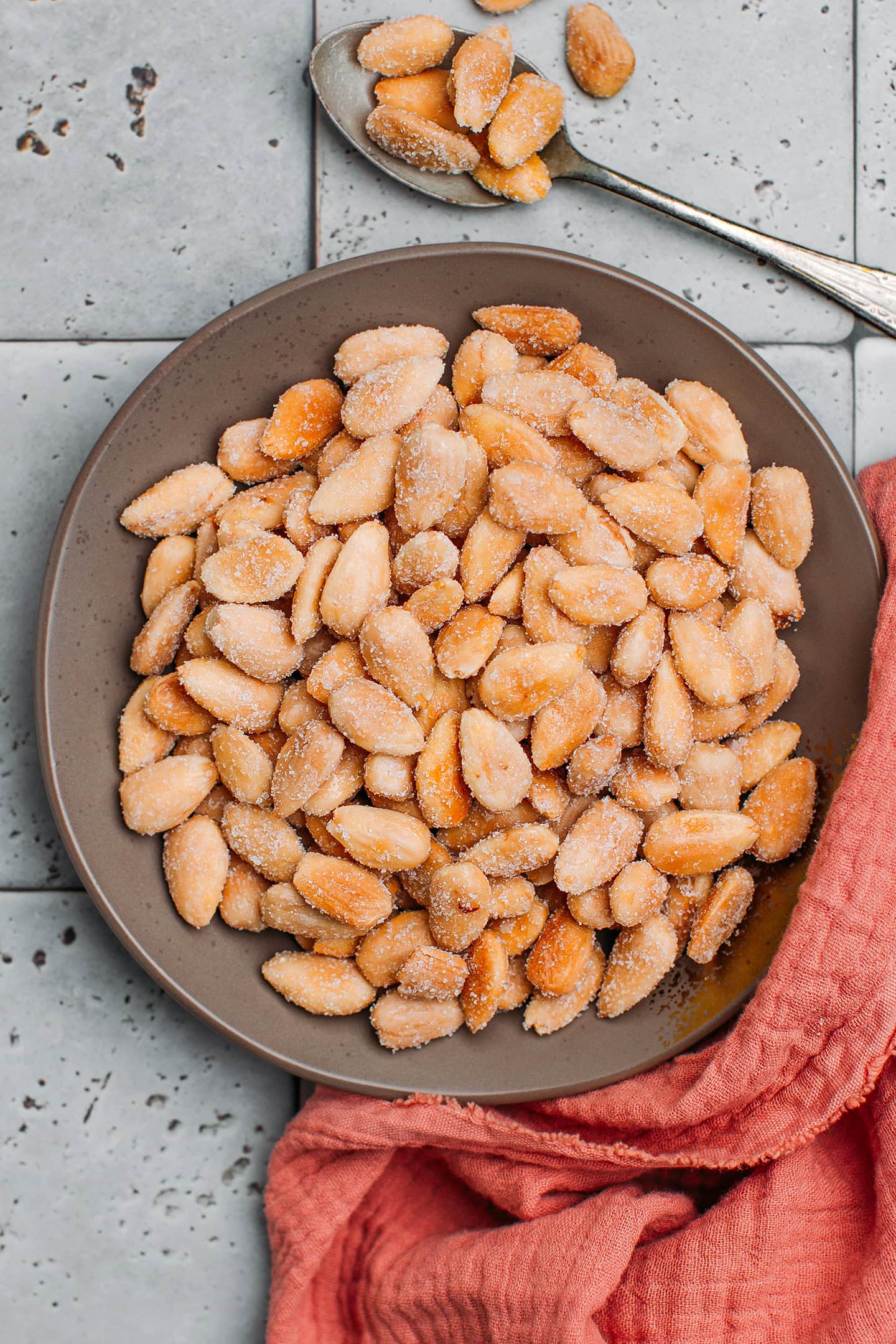 Roasted almonds in a small plate.