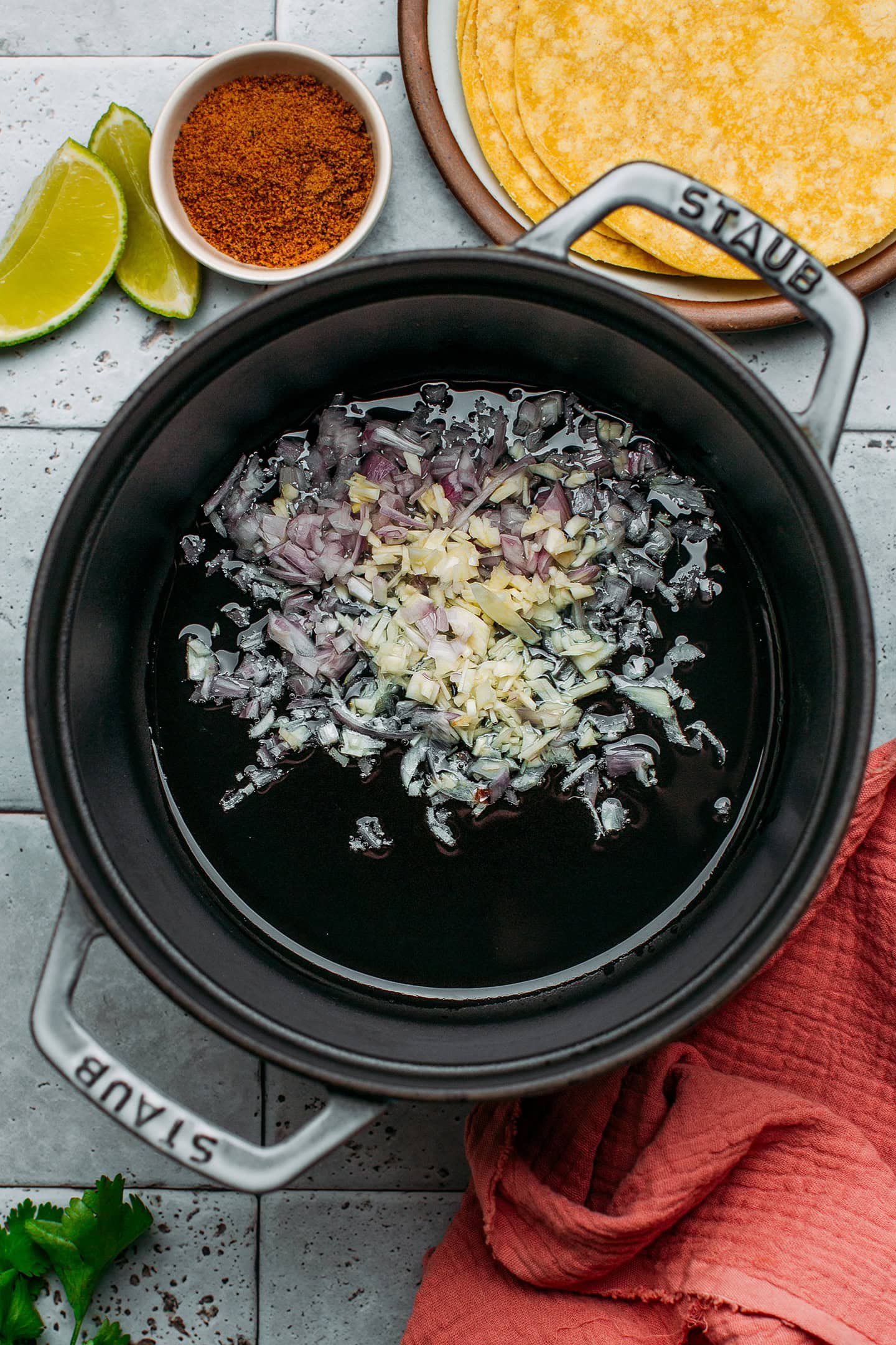 Minced garlic and shallots in a pot.