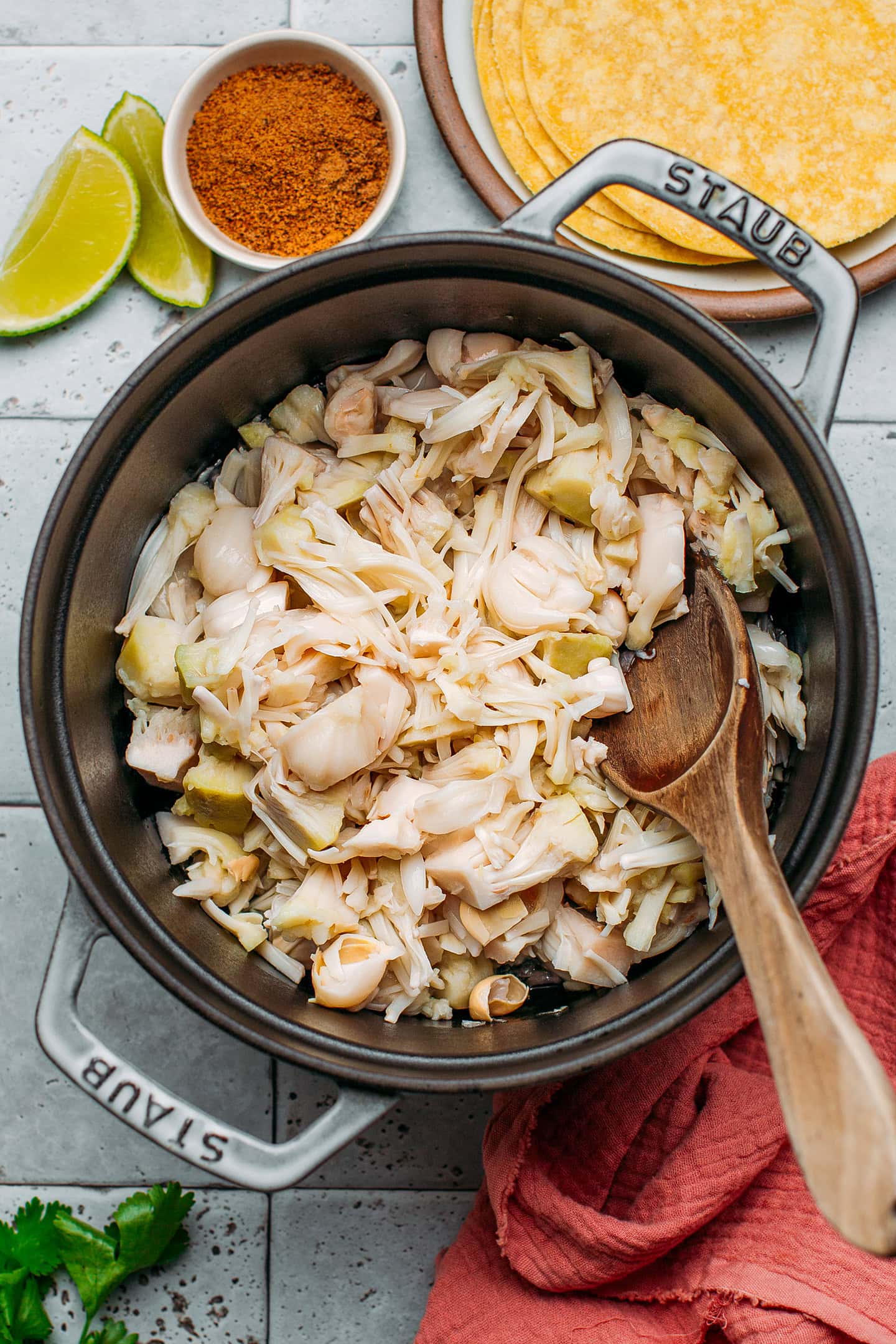 Shredded green jackfruit in a pot.