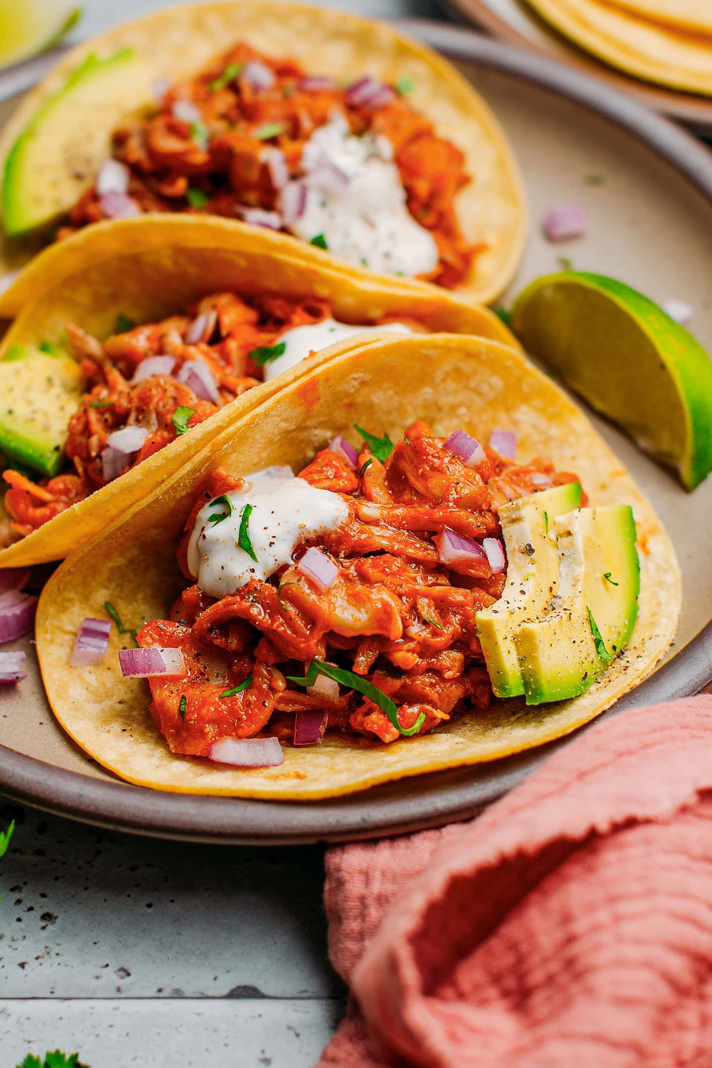 Pulled jackfruit taco with avocado and red onions.