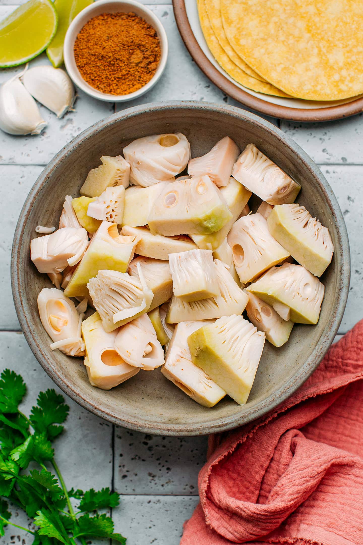 Young green jackfruit in a bowl.