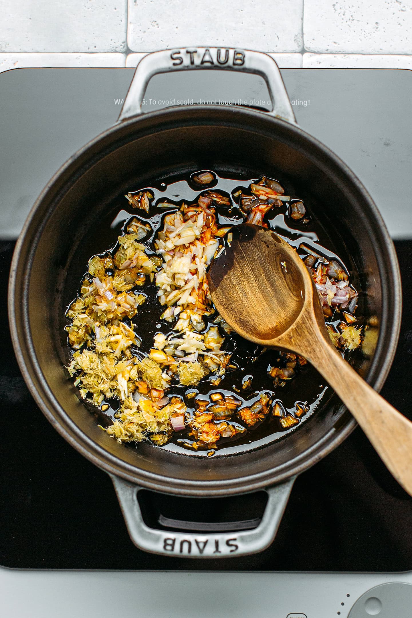 Garlic, lemongrass, and ginger in a pot.