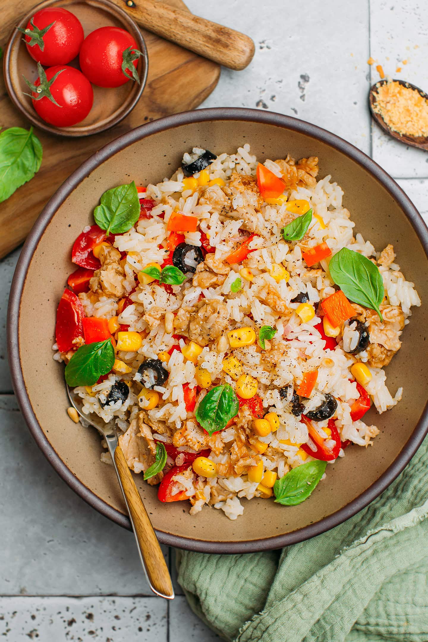 Salad with rice, olives, tomatoes, corn, and vegan tuna.