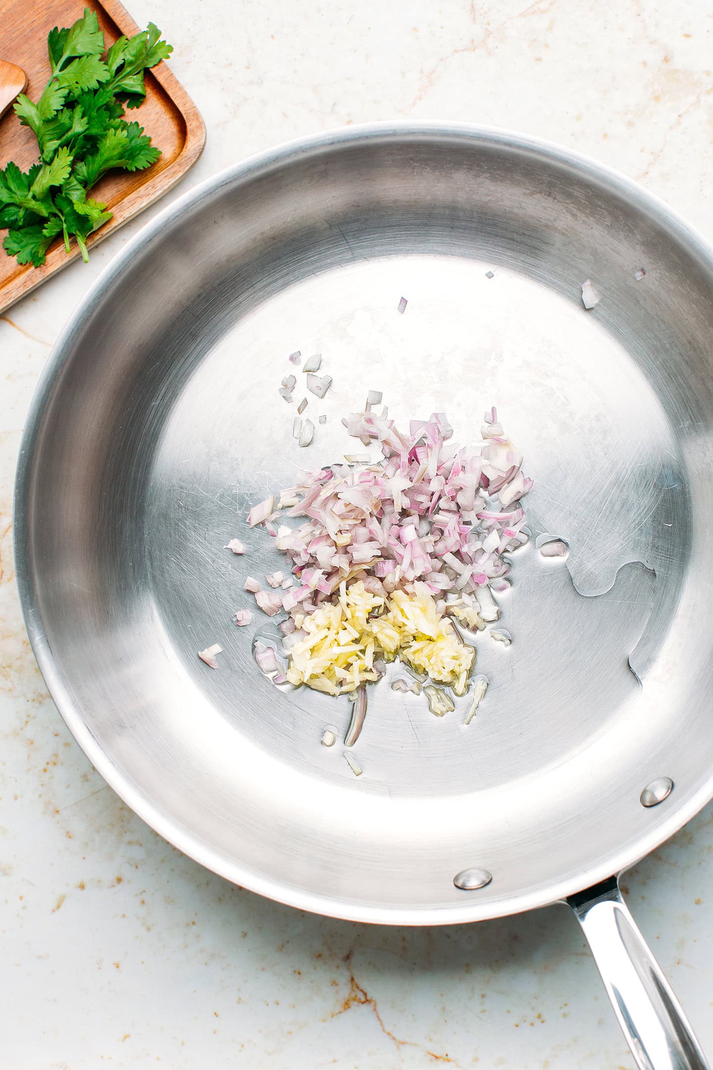 Minced shallots and garlic in a skillet.