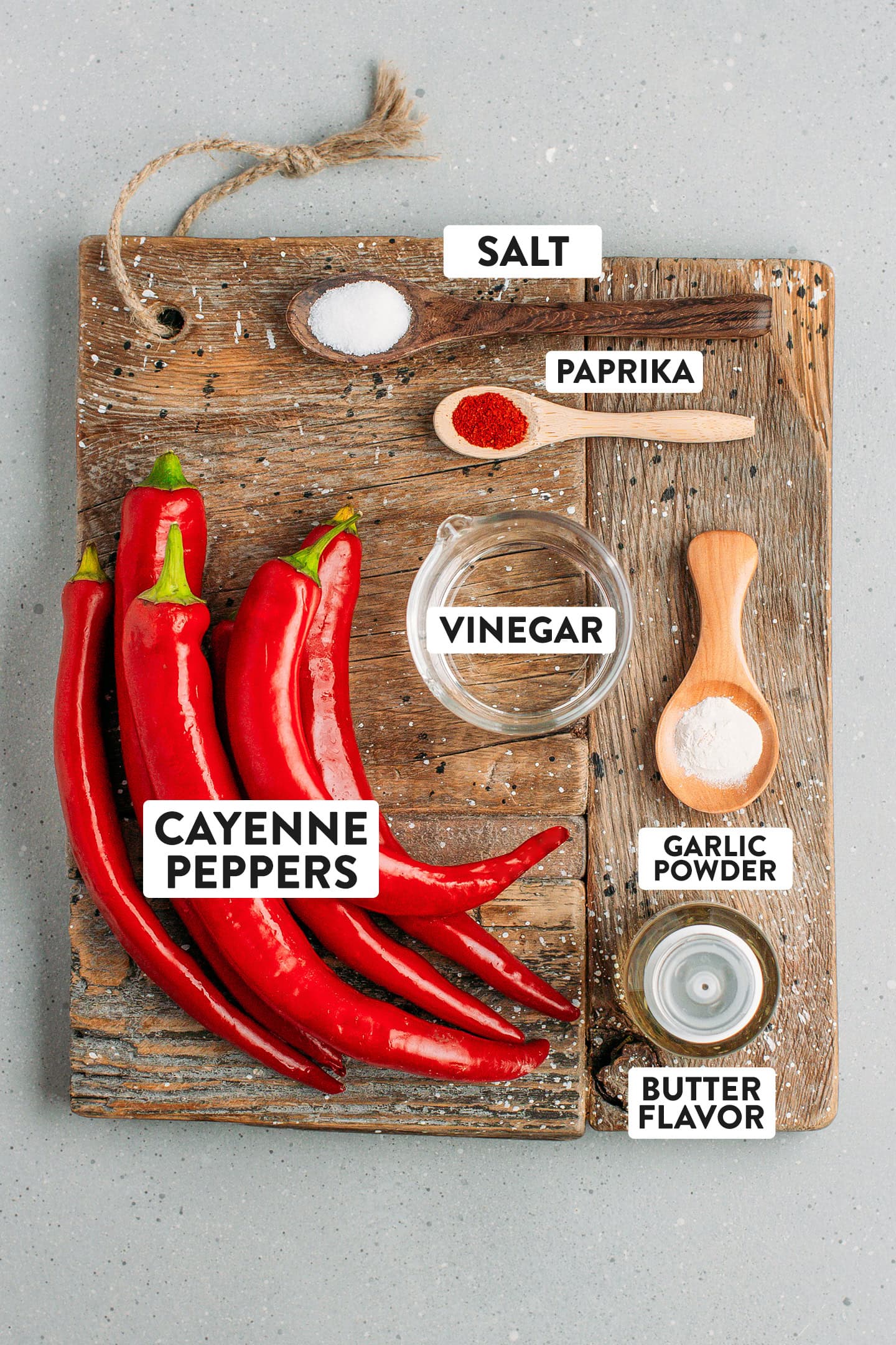 Ingredients like cayenne peppers, vinegar, salt, and garlic powder.