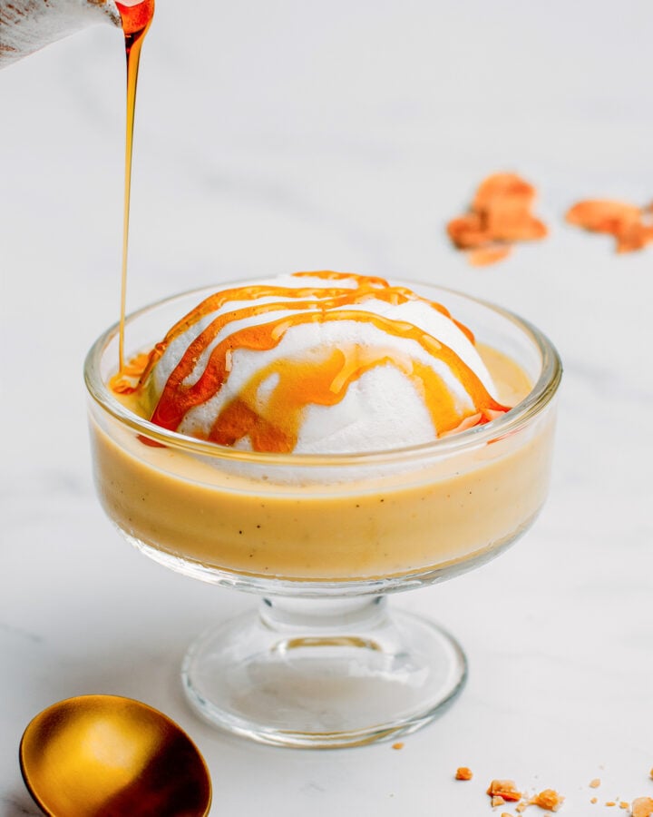 Pouring salted caramel on top of a meringue.