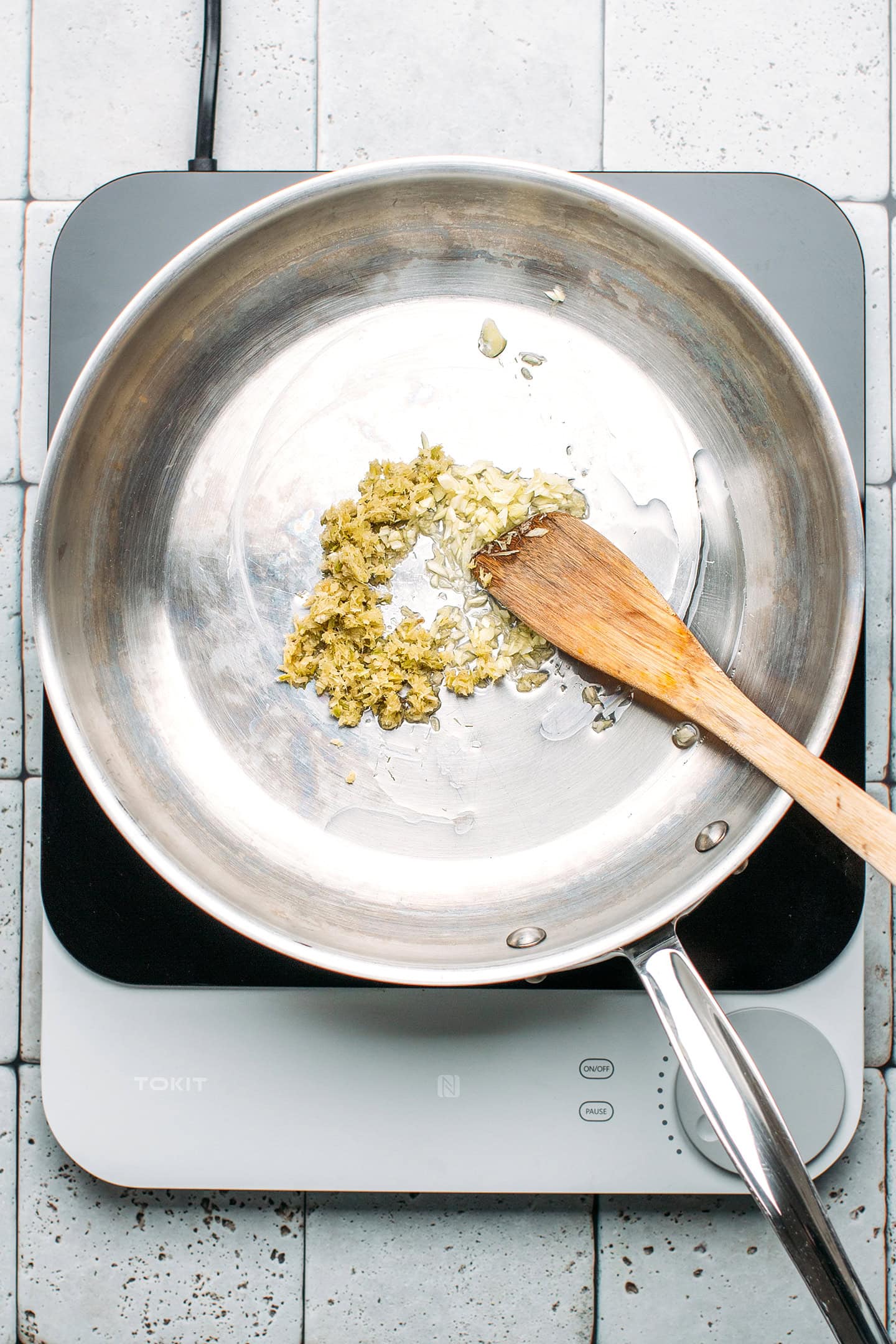 Minced lemongrass and garlic in a pan.