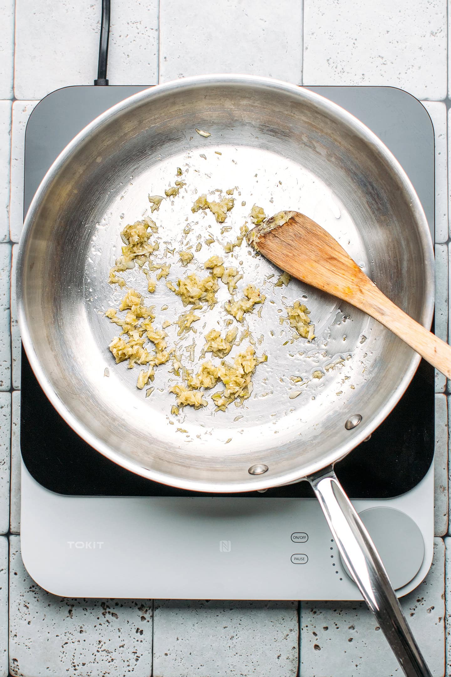 Sautéed lemongrass and garlic in a pan.