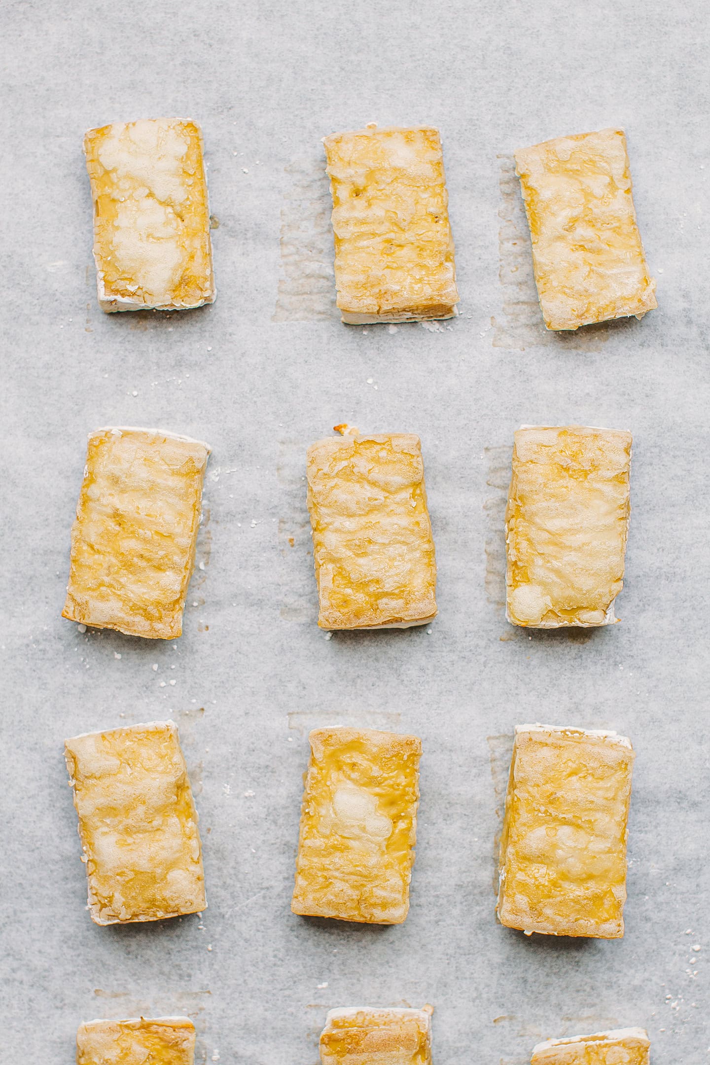 Baked tofu on a baking sheet.