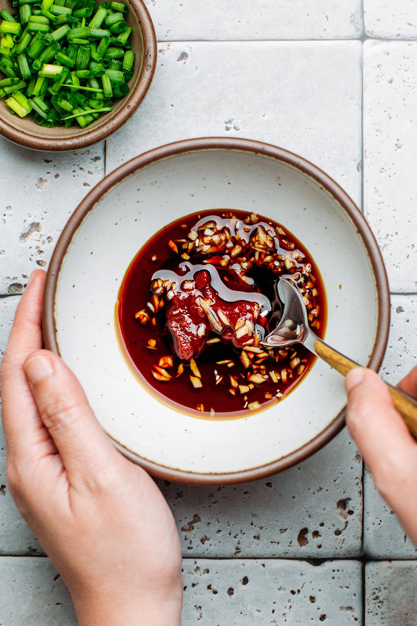 Gochujang, soy sauce, and garlic in a small bowl.