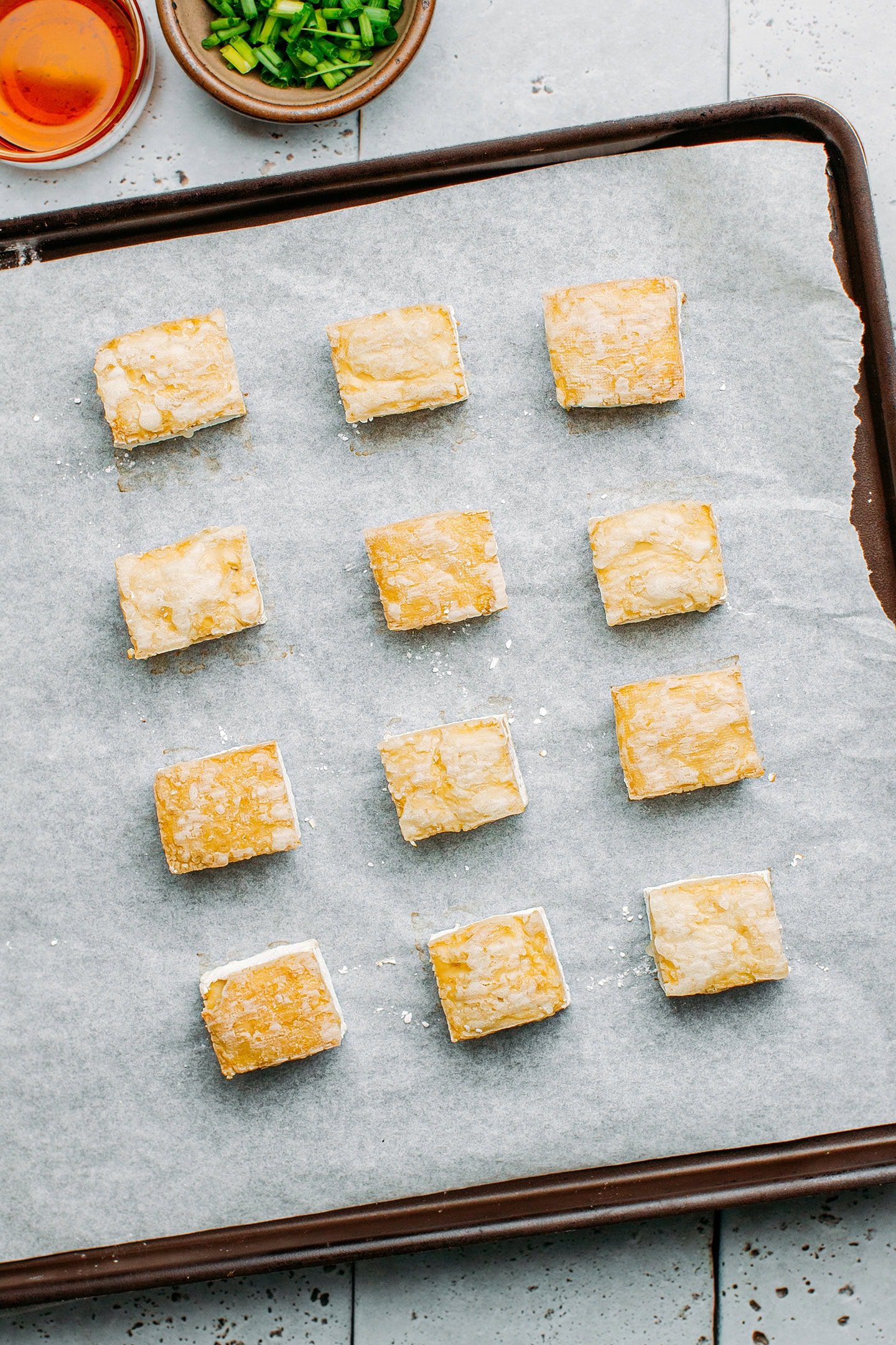 Baked tofu on a baking sheet.