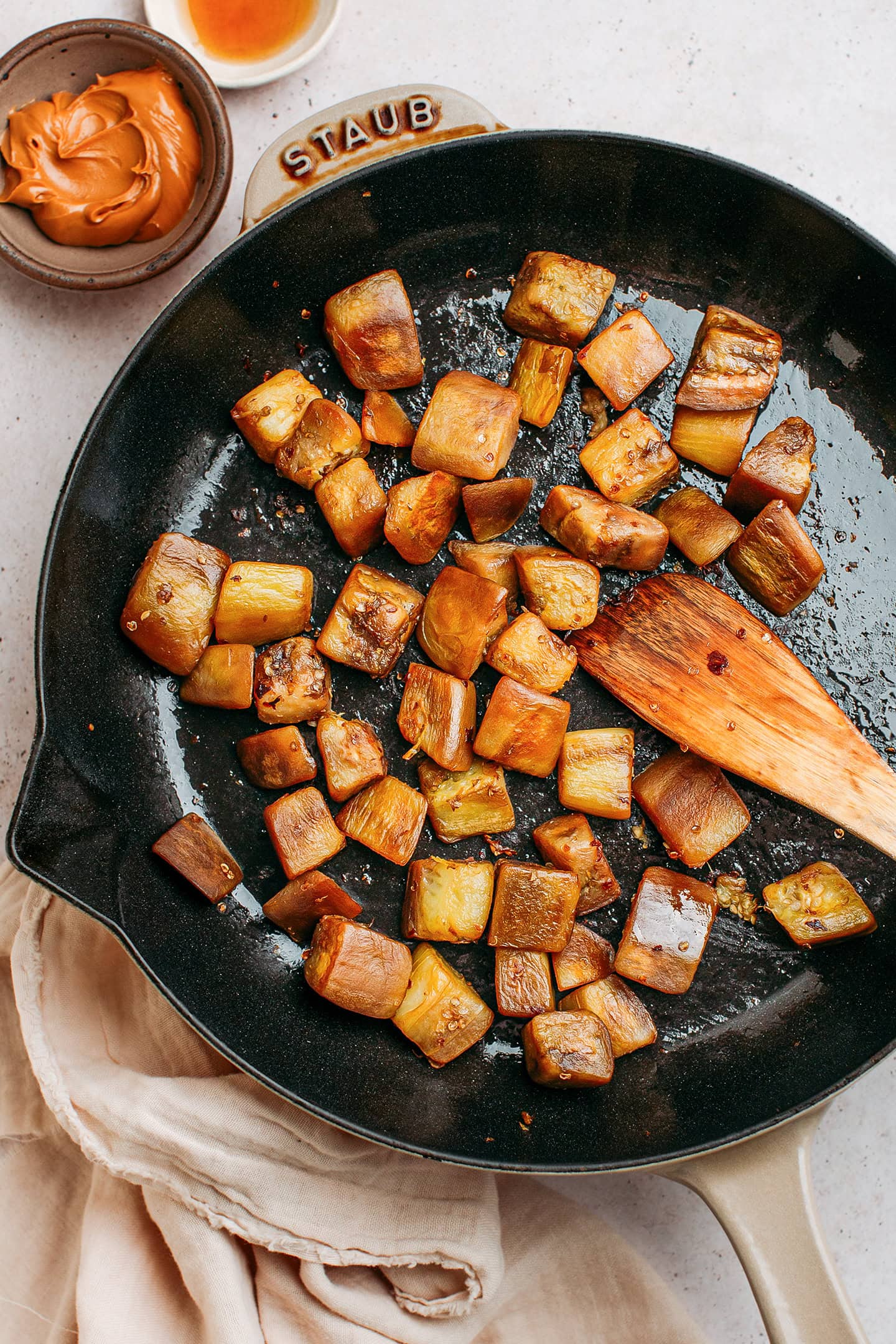 Sautéed eggplant in a skillet.