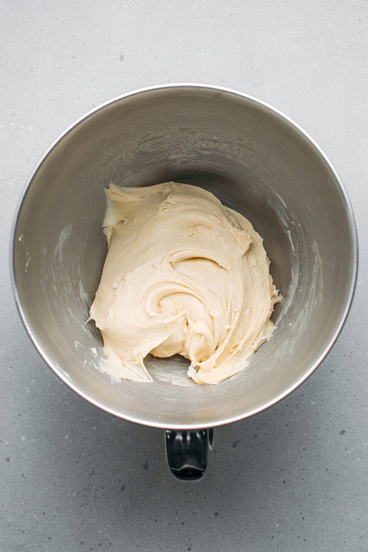 Kneaded brioche dough in a stand mixer bowl.