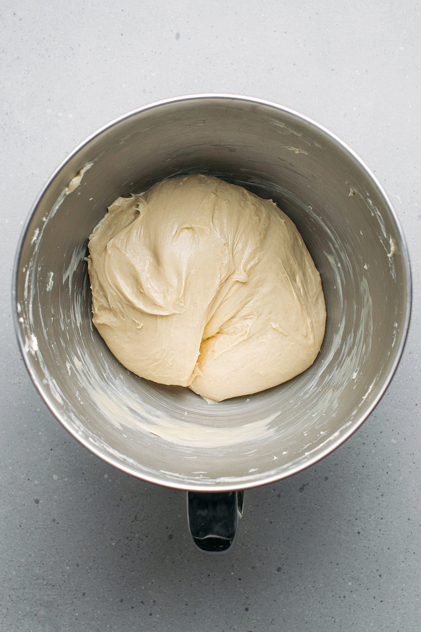 Brioche dough in the bowl of a stand mixer.