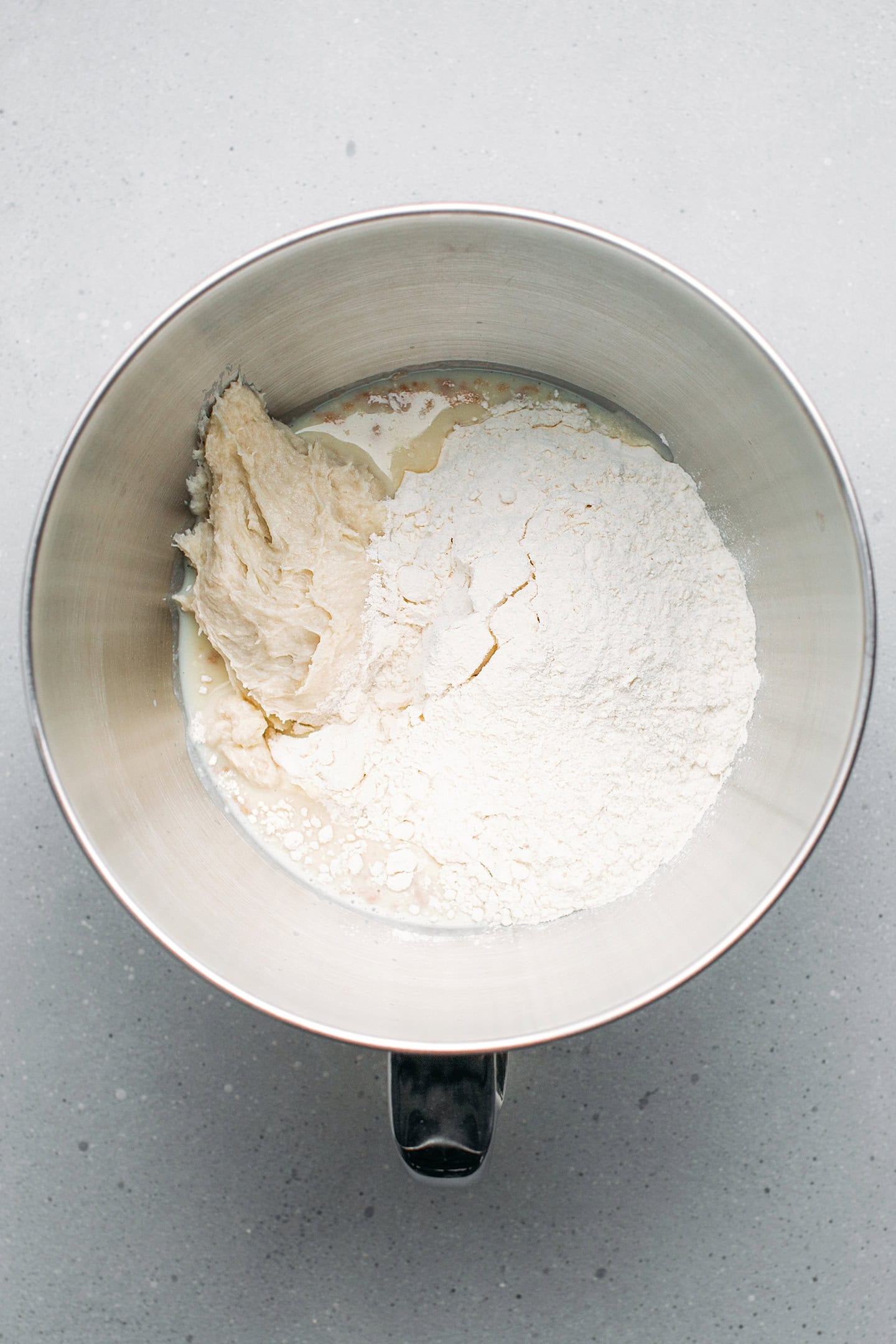 Yudane, flour, and milk in a stand mixer bowl.