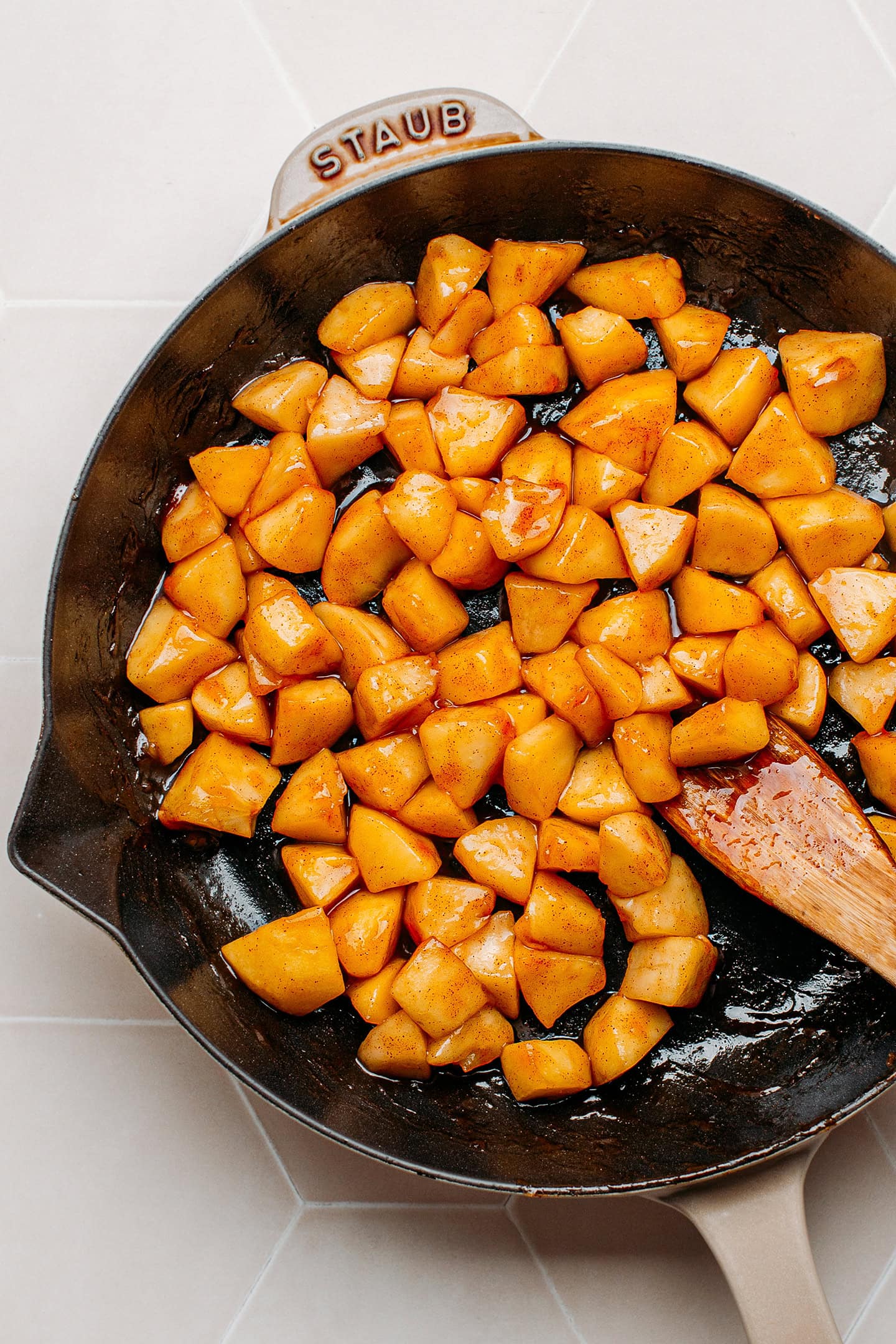 Sautéed apples in a skillet.