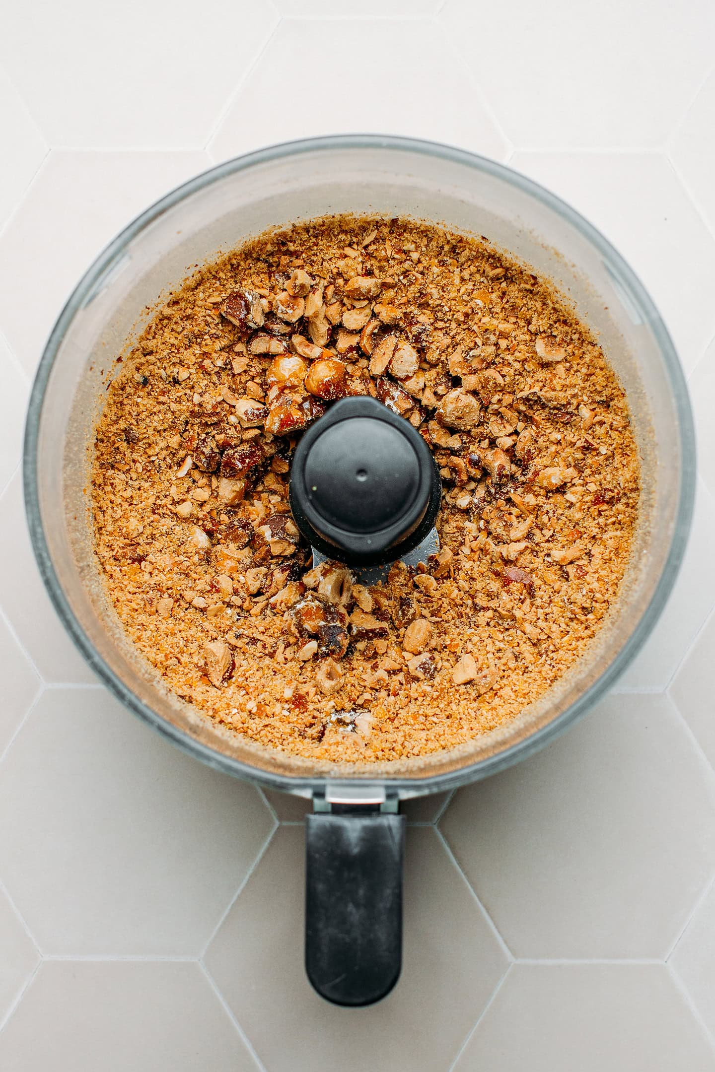 Hazelnuts and almonds ground into a powder in a food processor.