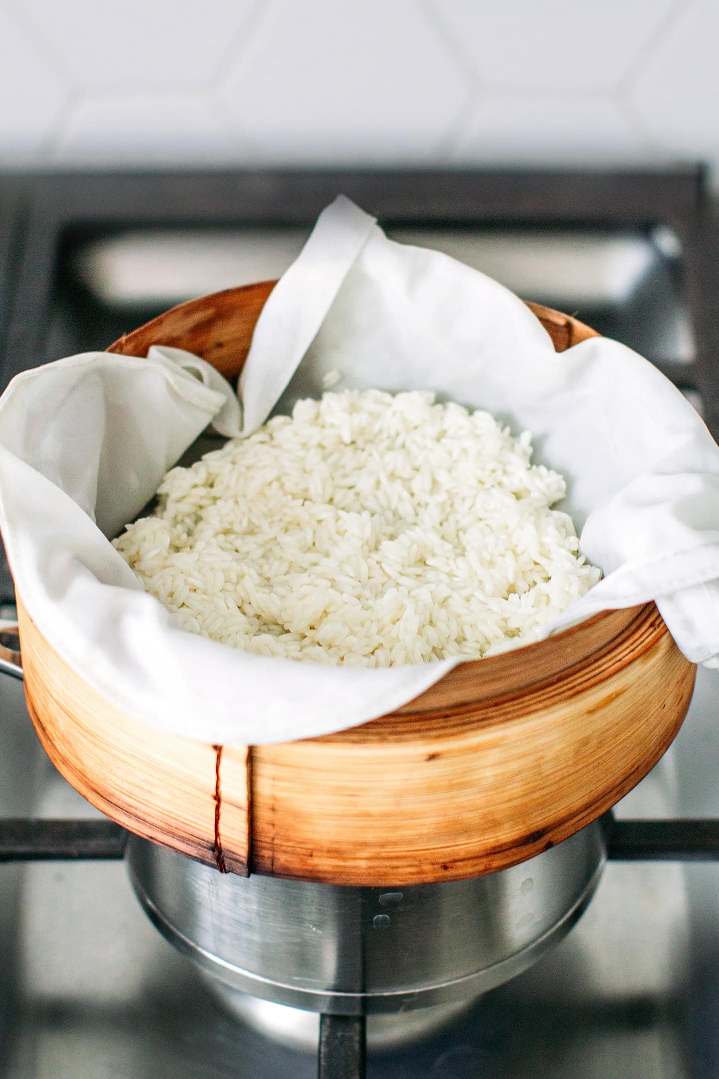 Sticky rice in a bamboo basket steamer.