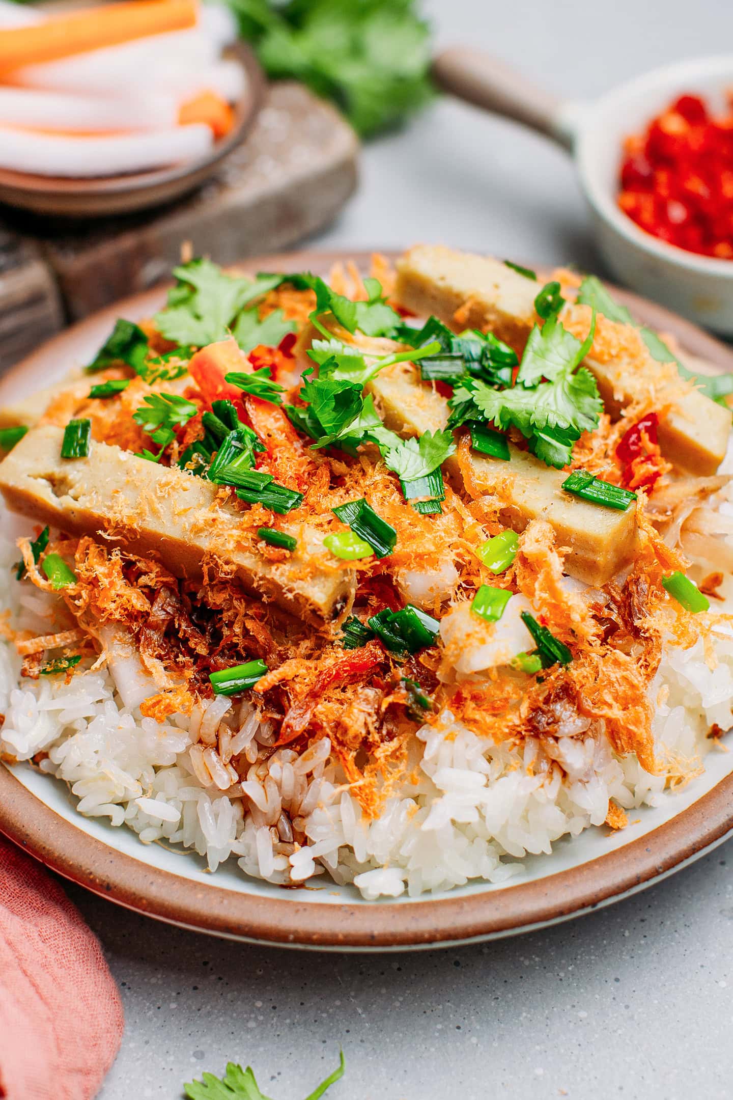 Close-up of savory sticky rice with bologna, meat floss, and green onions.