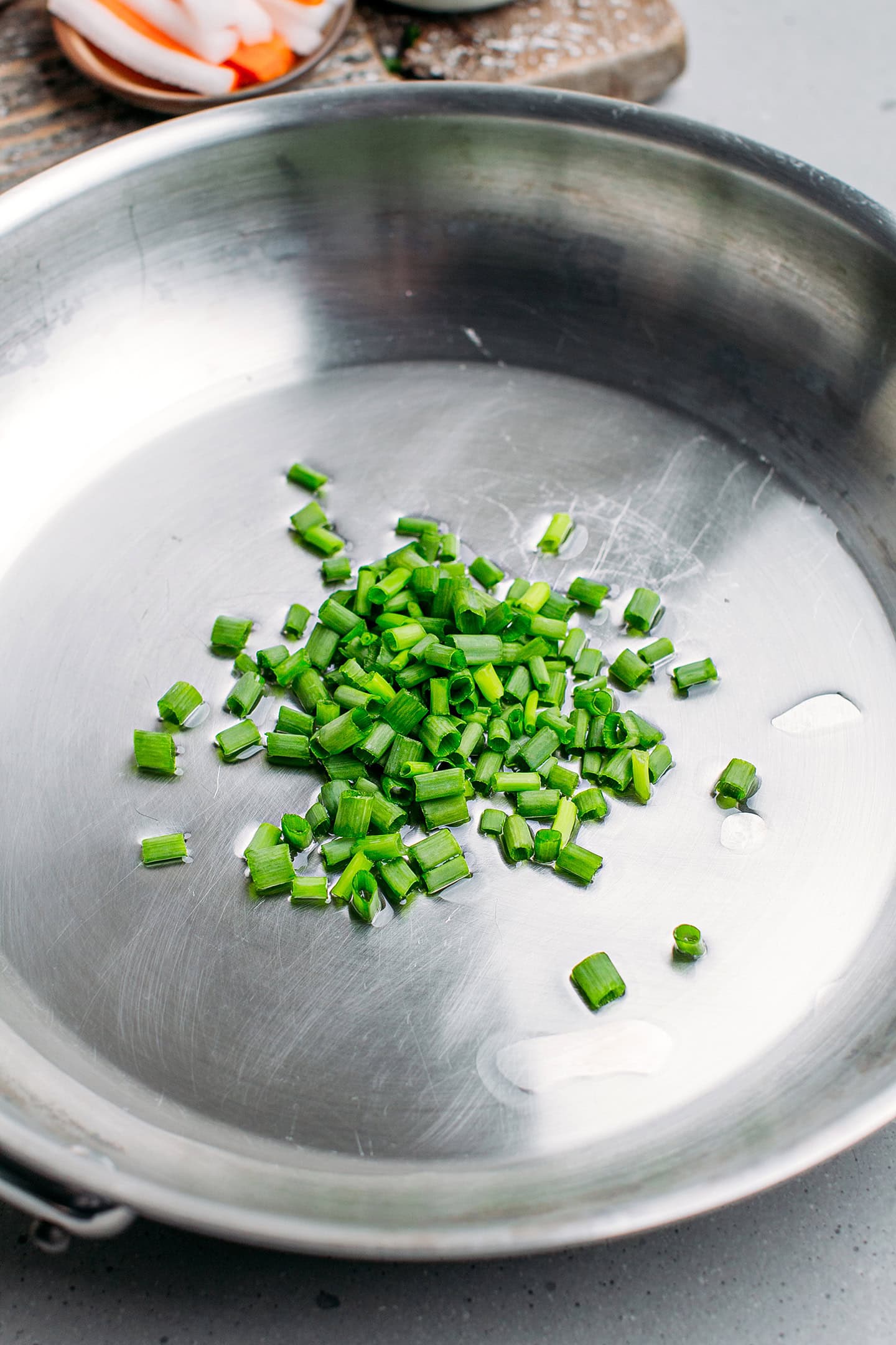 Chopped green onions in a pan.