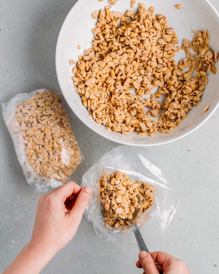 Filling freezer bags with cooked soybeans.