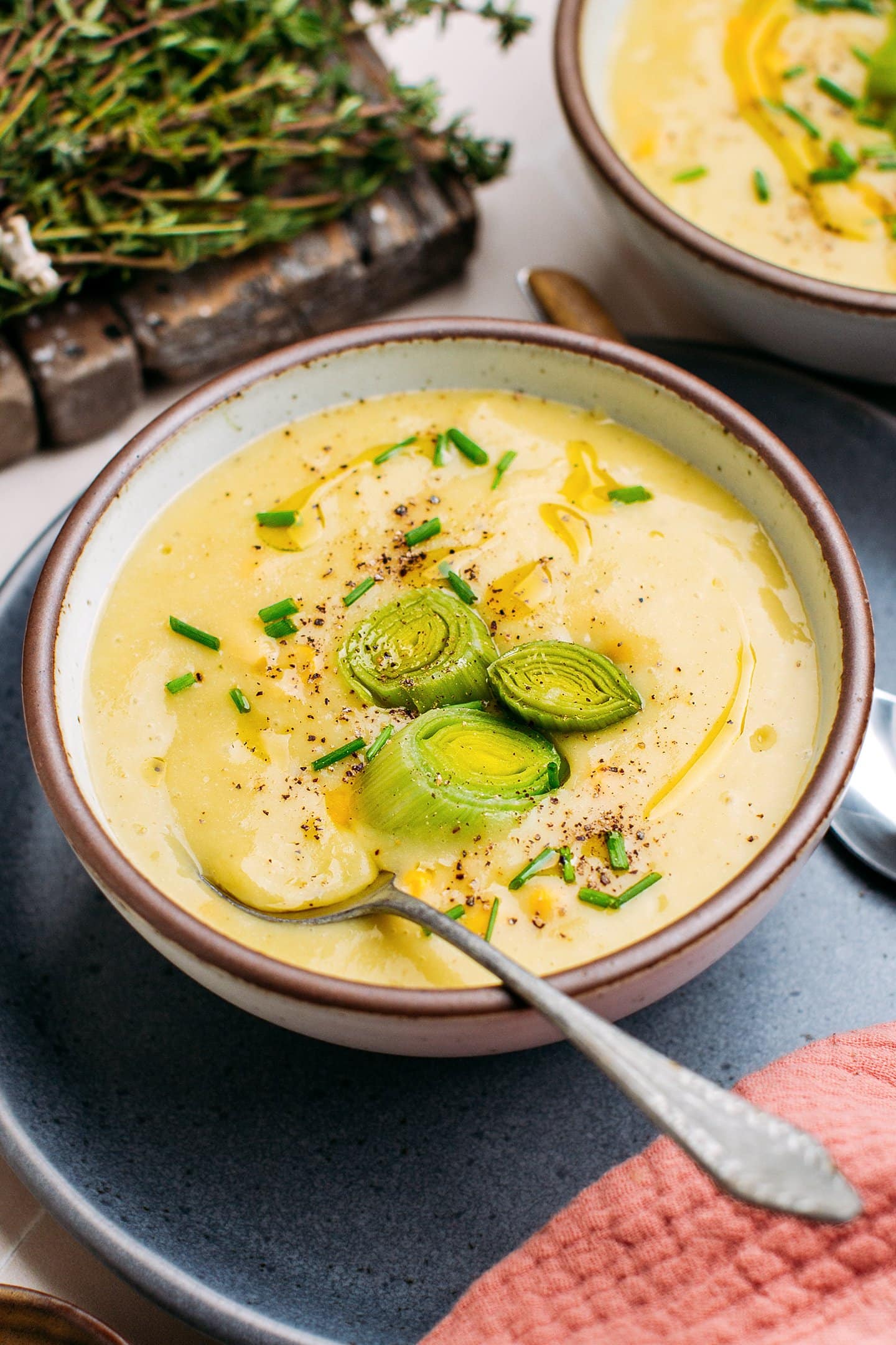 Close-up of a bowl containing potato leek soup.