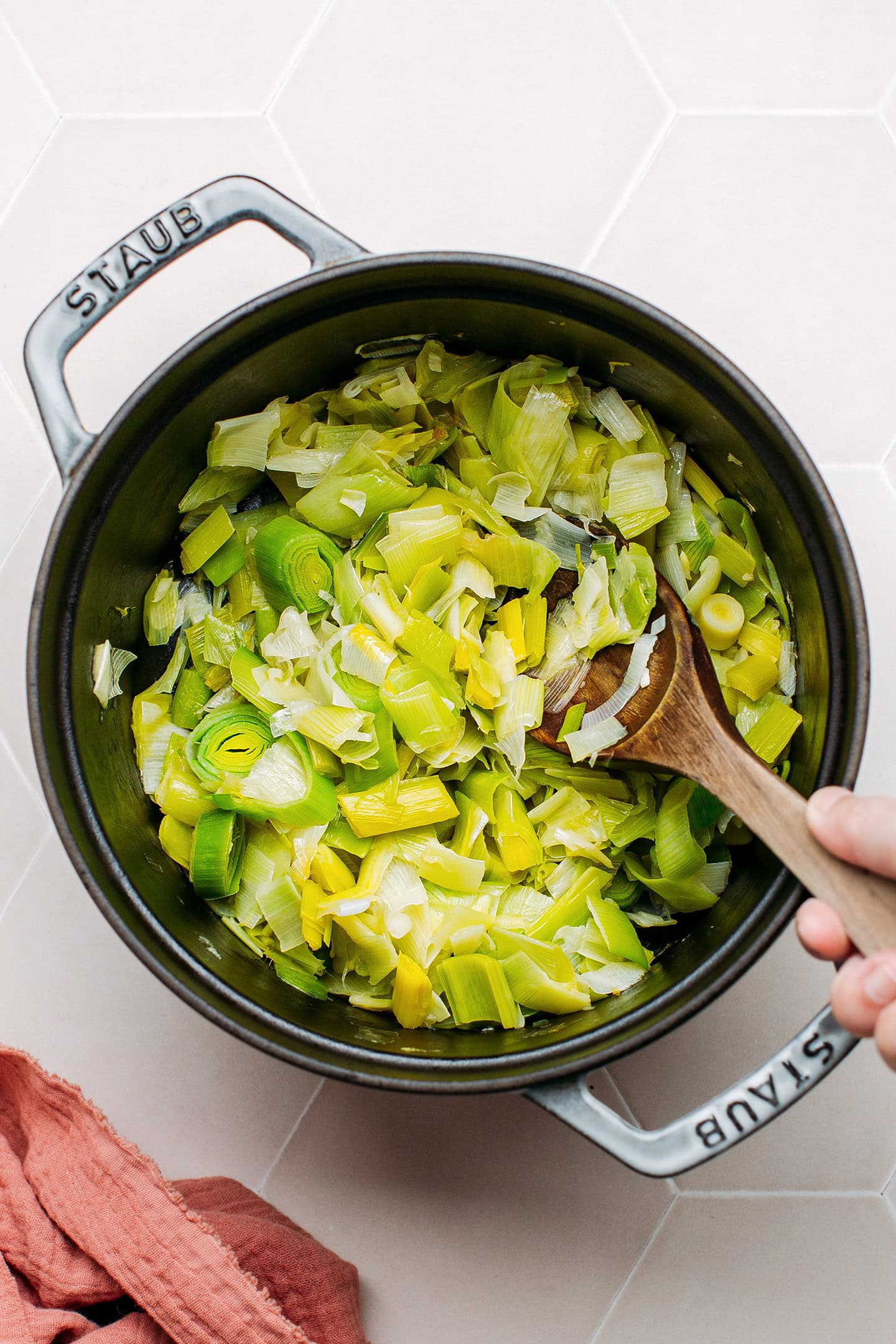 Sautéed leeks in a pot.