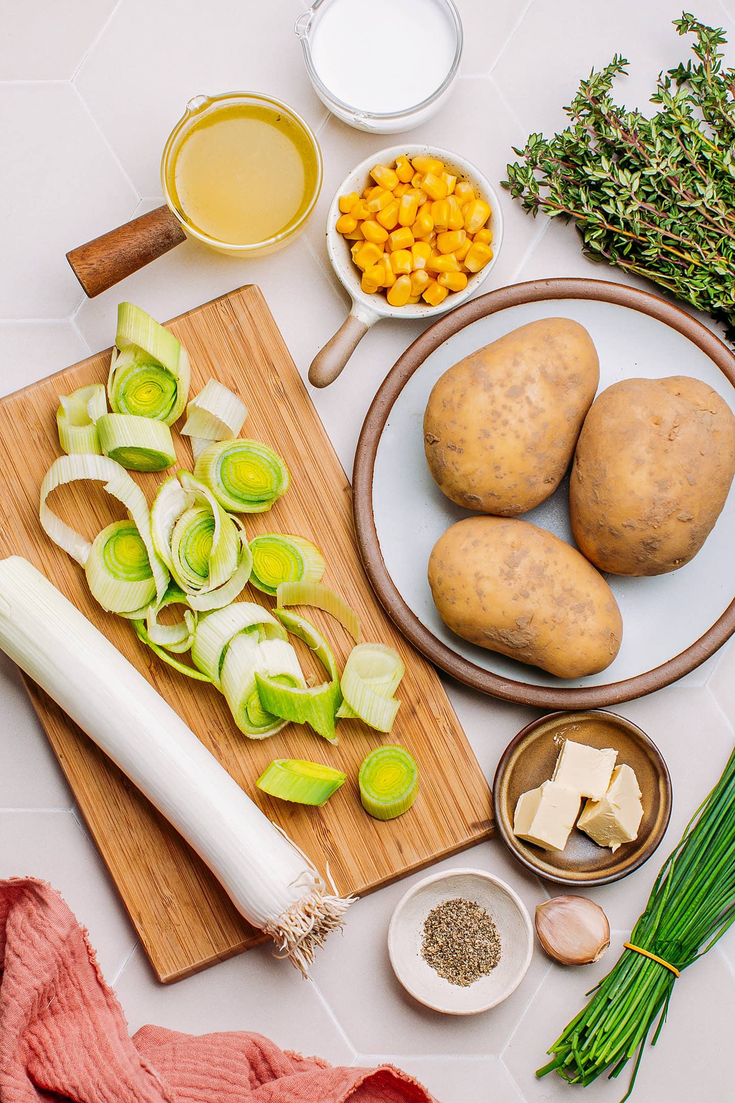 Ingredients like potatoes, leeks, butter, garlic, and vegetable broth.