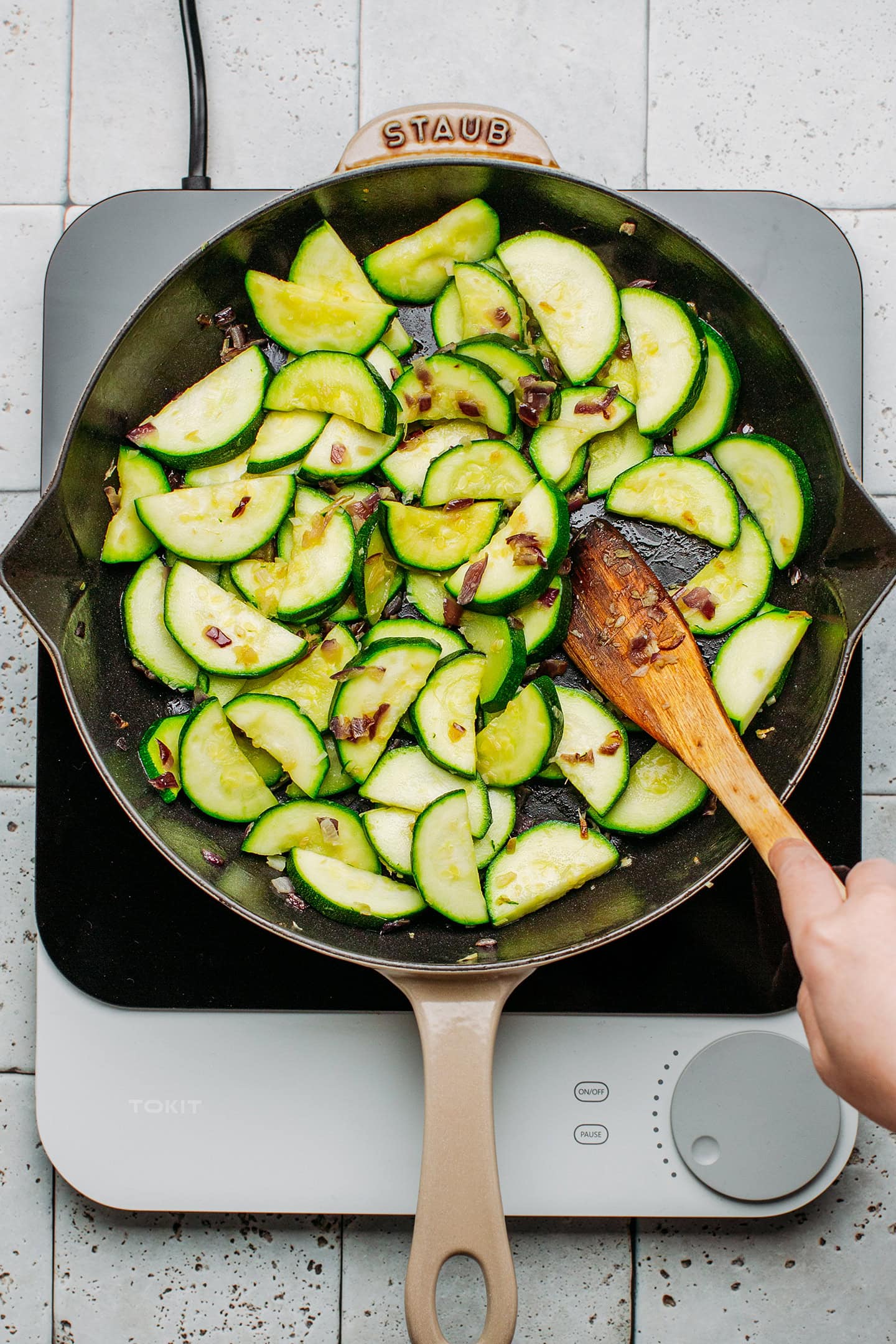 Sliced zucchini in a pan.