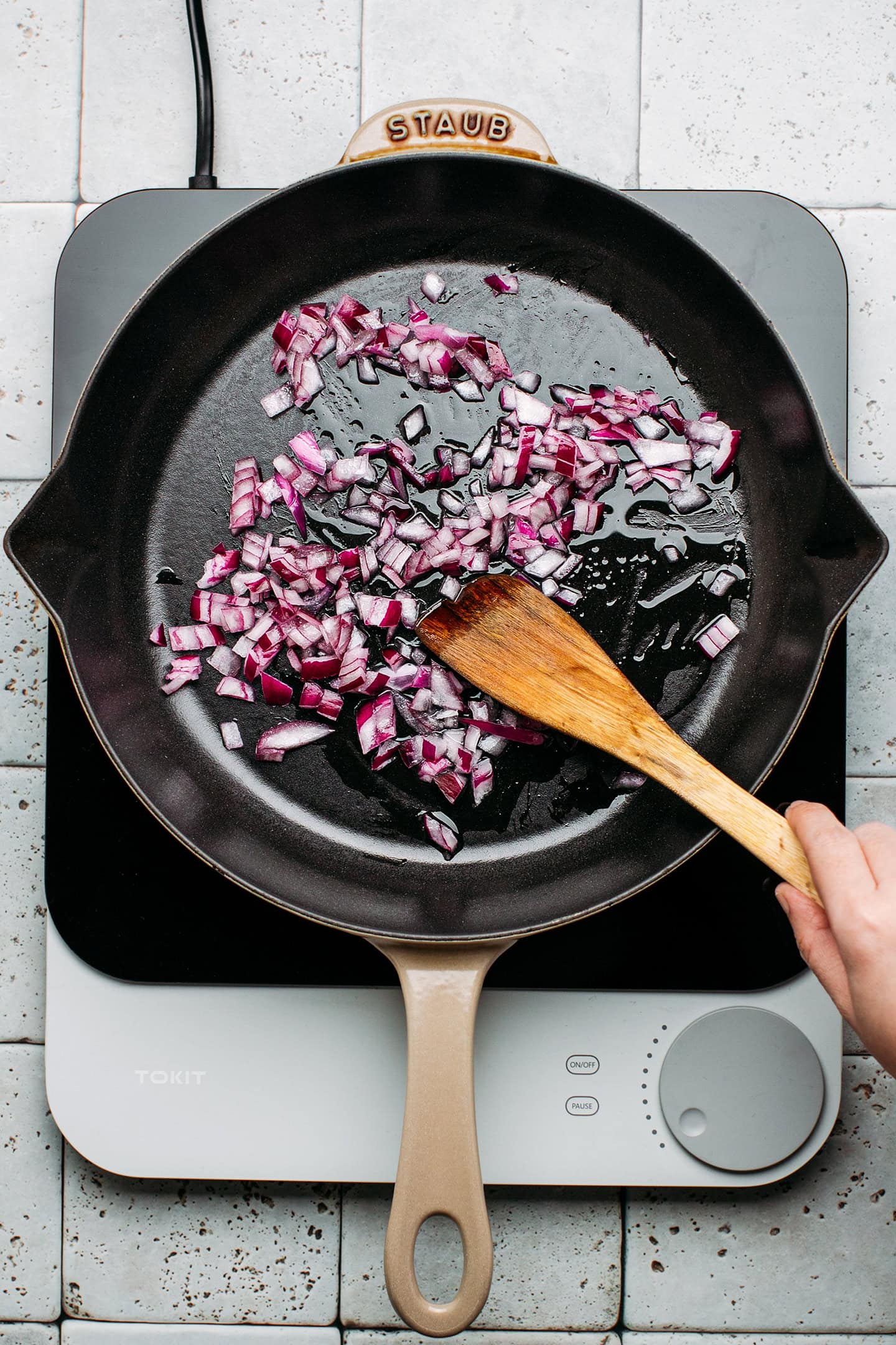 Diced red onion in a pan.