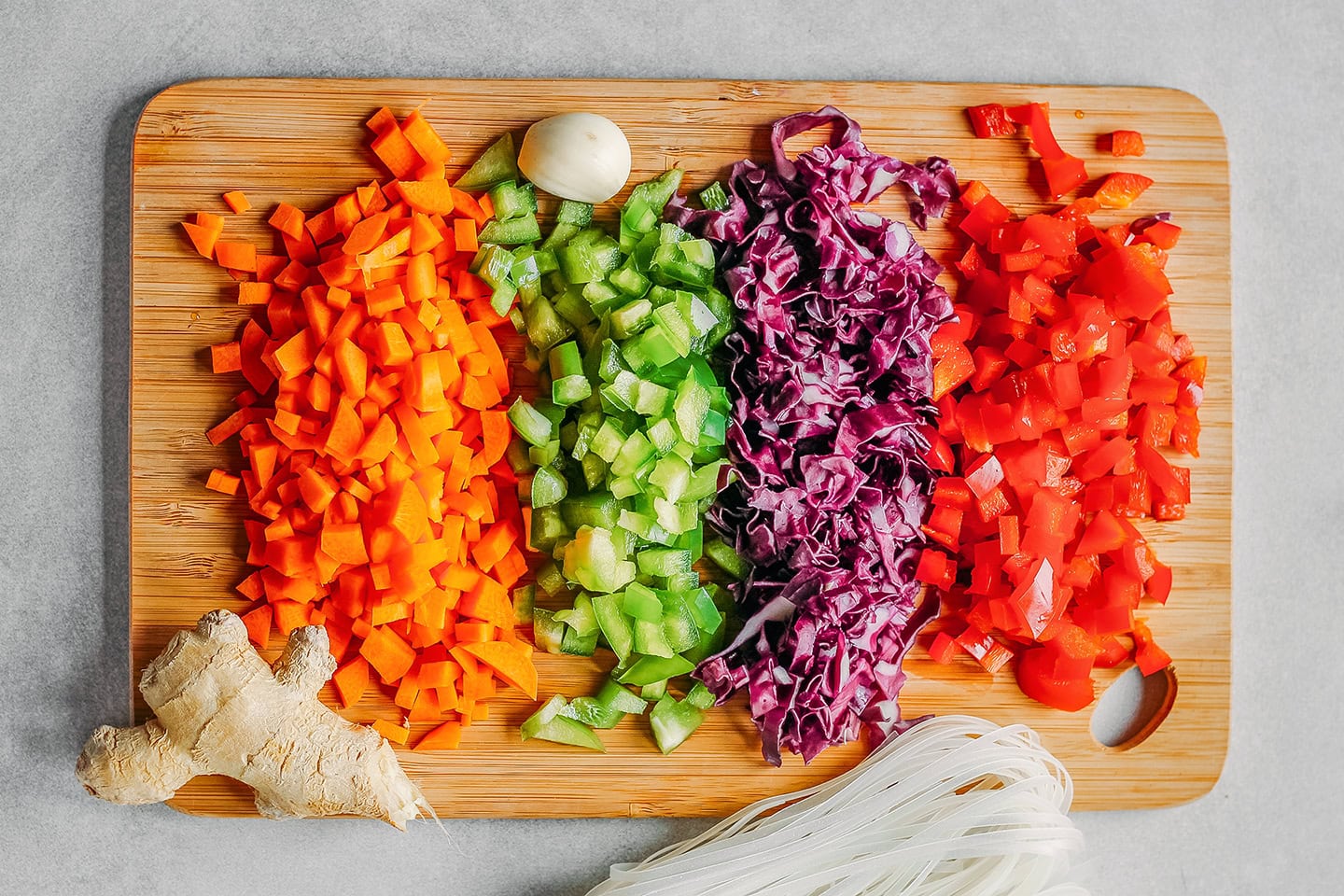 Diced carrots, bell peppers, and red cabbage.