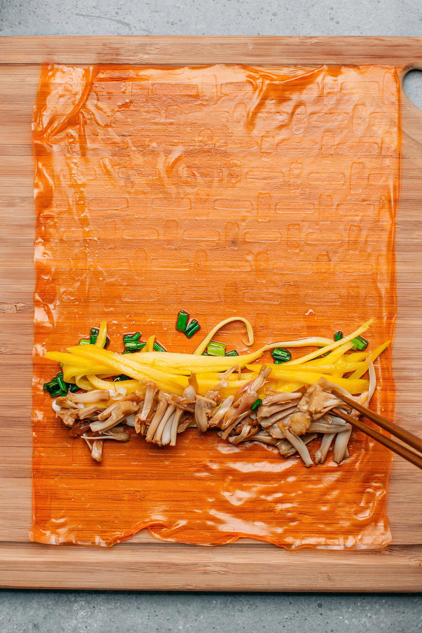 Shredded mango and jackfruit on a rice paper sheet.