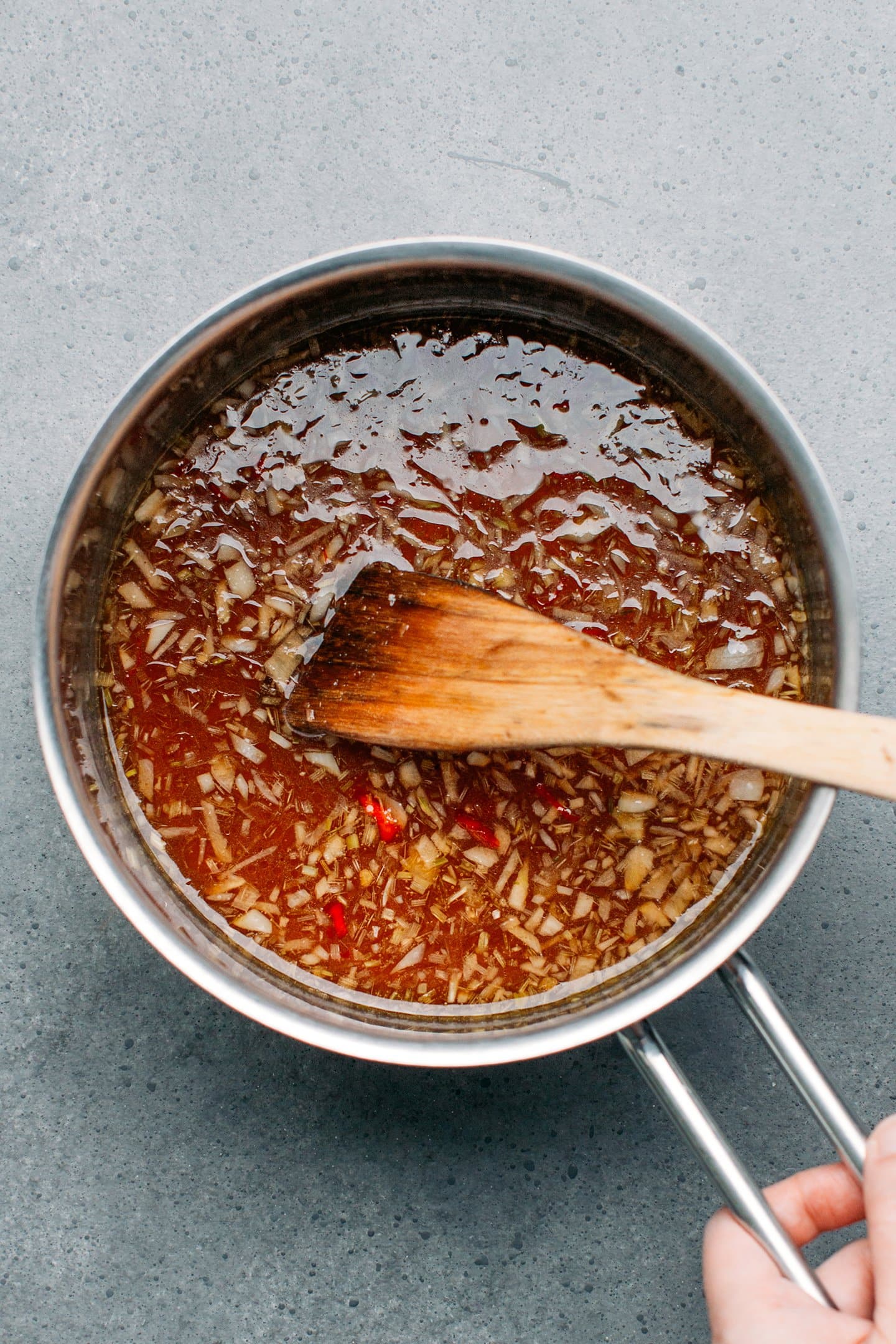 Sweet and sour tamarind sauce in a saucepan.