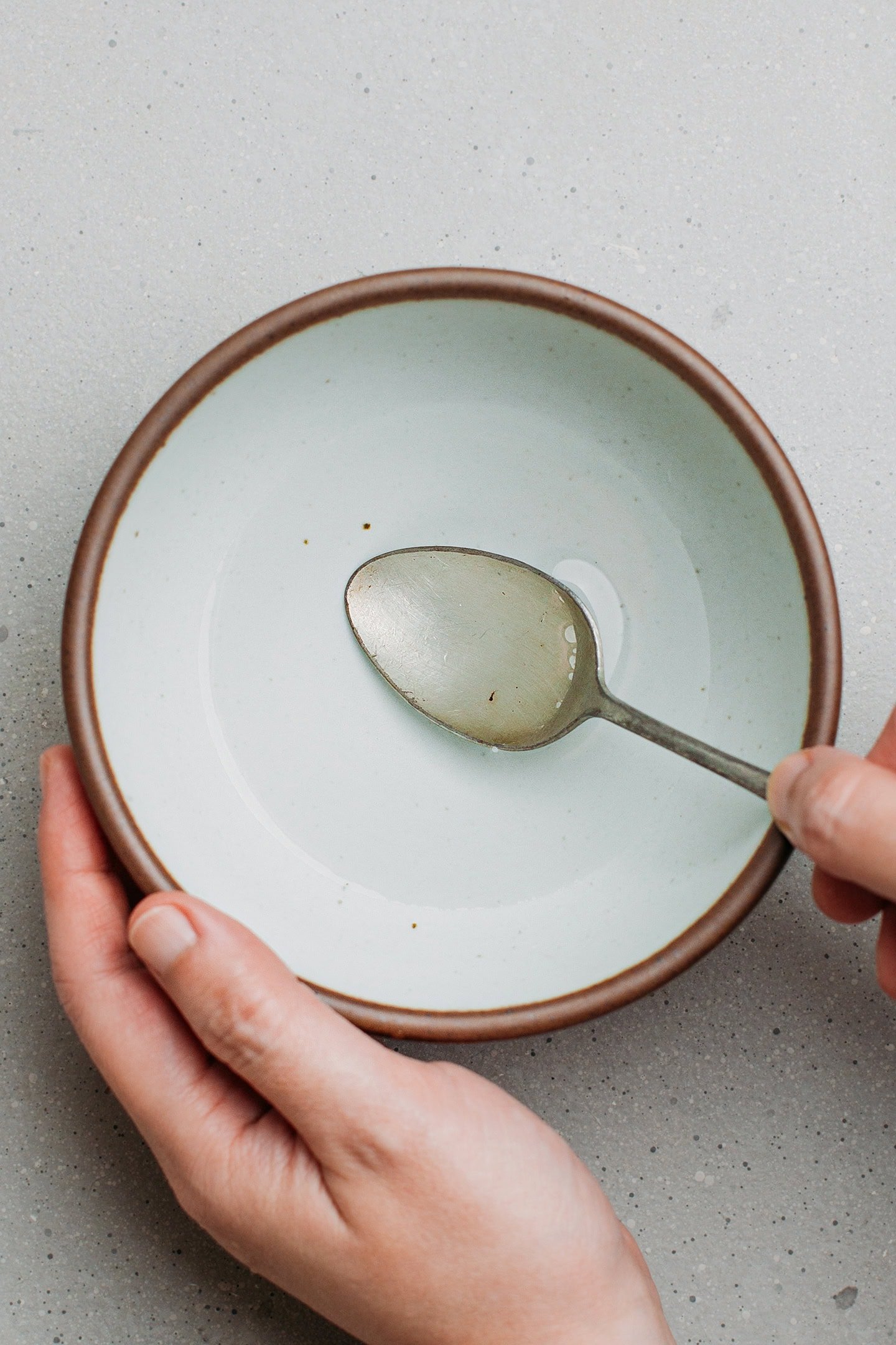 Stirring brine in a small bowl.