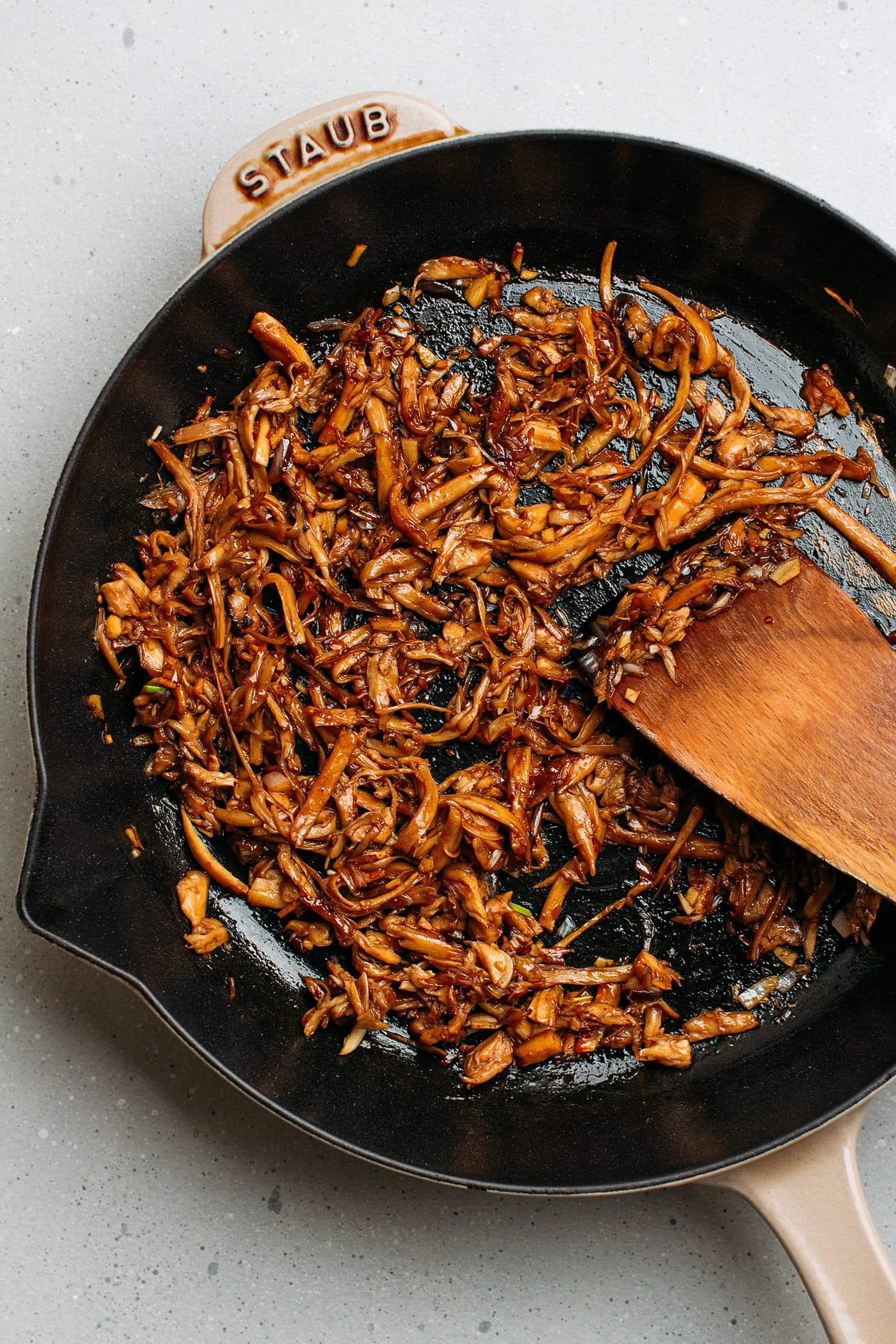 Sautéed pulled mushrooms in a skillet.