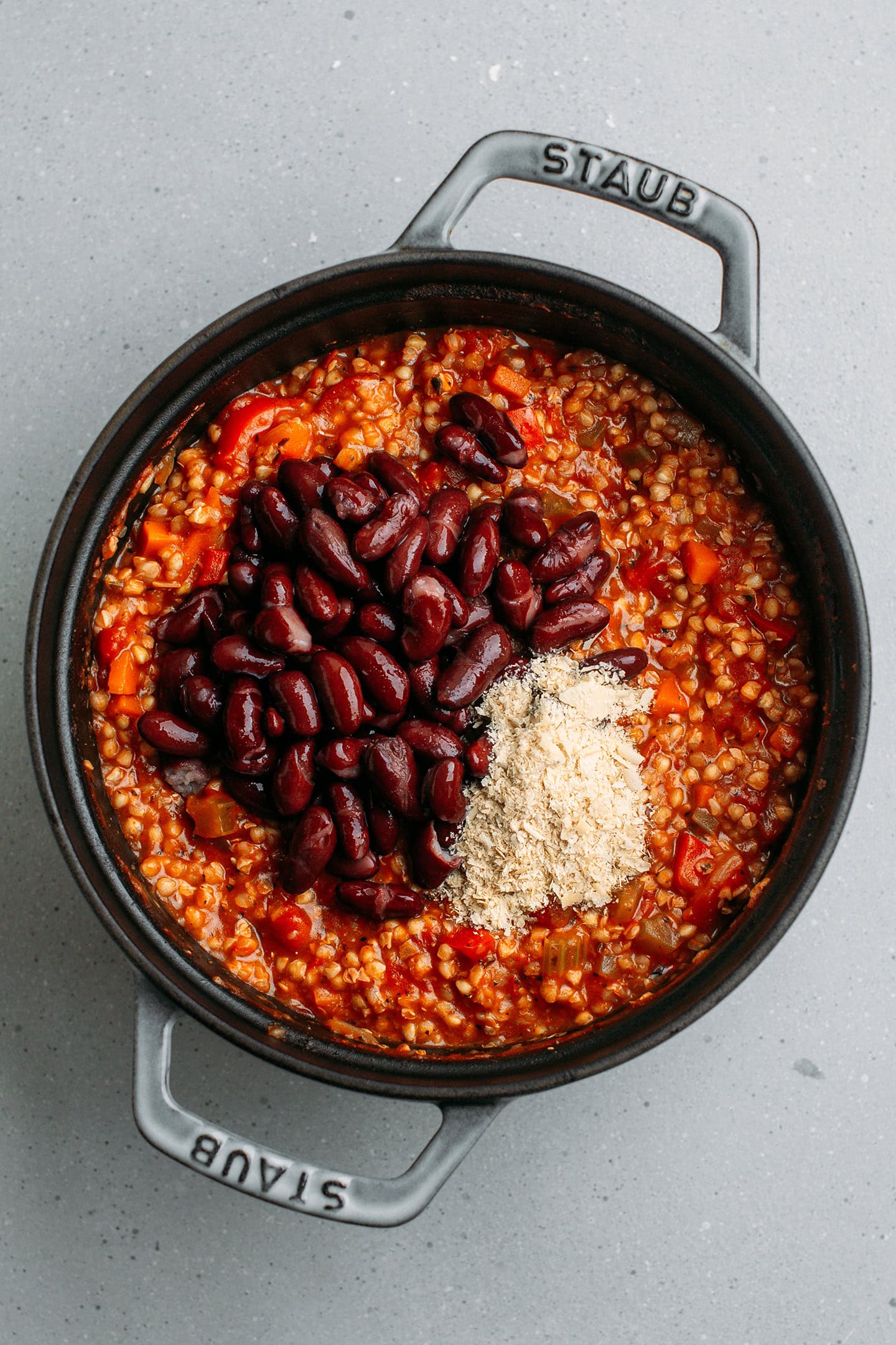 Buckwheat chili with red beans and nutritional yeast in a pot.